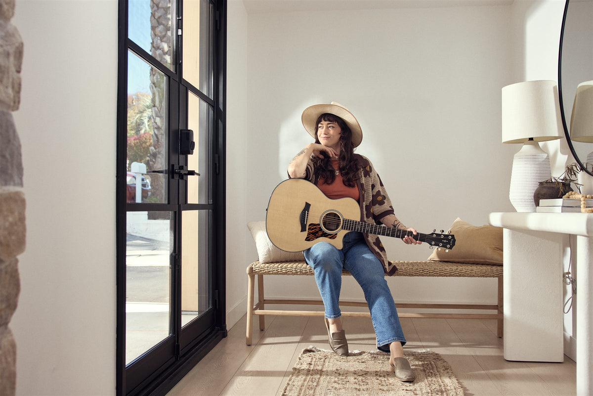 Taylor 400 Series lifestyle photo — musician playing a Taylor 414ce at home, The Acoustic Shoppe