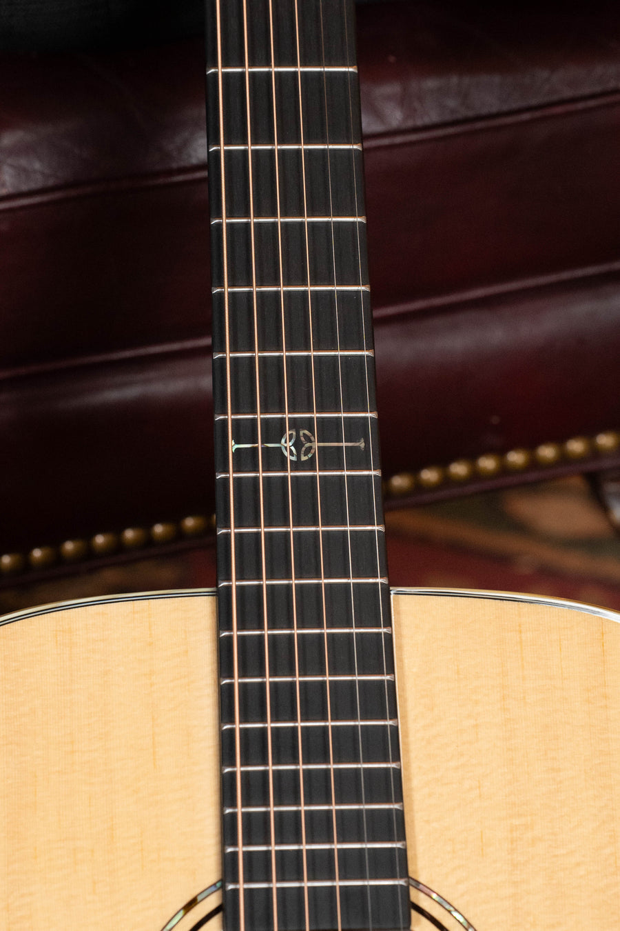 Close-up of an Alvarez Laureate Series LD60e Sitka/Mahogany Dreadnought Guitar neck and fretboard, showing six strings, frets, and decorative inlay. Features LR Baggs Hifi pickup.
