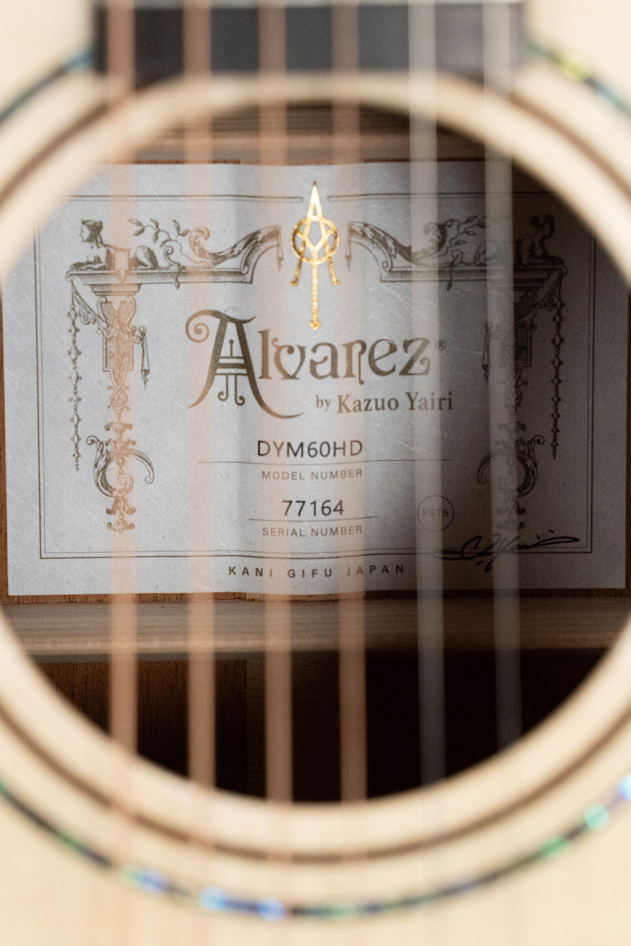 Close-up of Alvarez Yairi Honduran mahogany dreadnought guitar label inside soundhole. - Alvarez Yairi Honduran Series DYM60HD Adirondack/Vintage Honduran Mahogany Dreadnought Acoustic Guitar #7164 - Default Title
