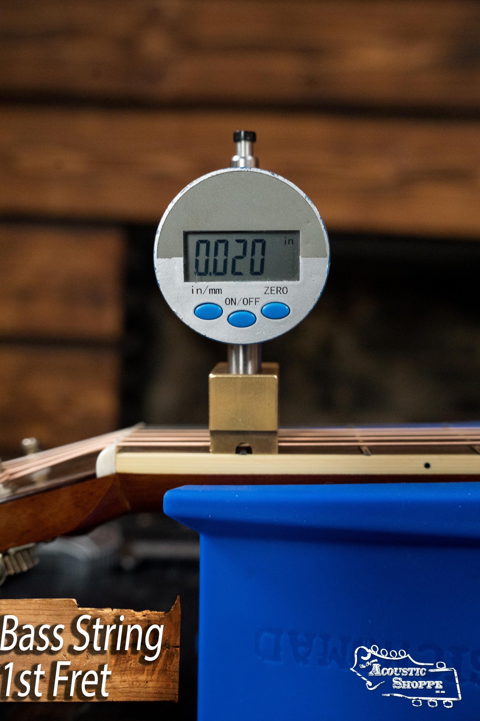 A digital gauge shows a 0.020-inch string height at the 1st fret of the Atkin White Rice Baked Sitka/Rosewood Dreadnought Acoustic Guitar #3497 by Atkin Guitars, set against a wooden background with Bass String 1st Fret text visible.