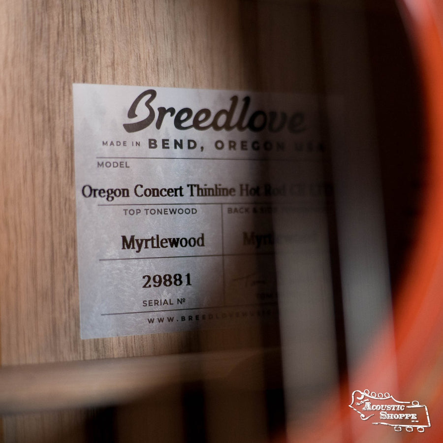 Close-up of a Breedlove Limited Oregon Series All Myrtlewood Thinline Hot Rod Concert CE Guitar label (#9881) inside the body, showing LR Baggs pickup and The Acoustic Shoppe logo. Brand: Breedlove.