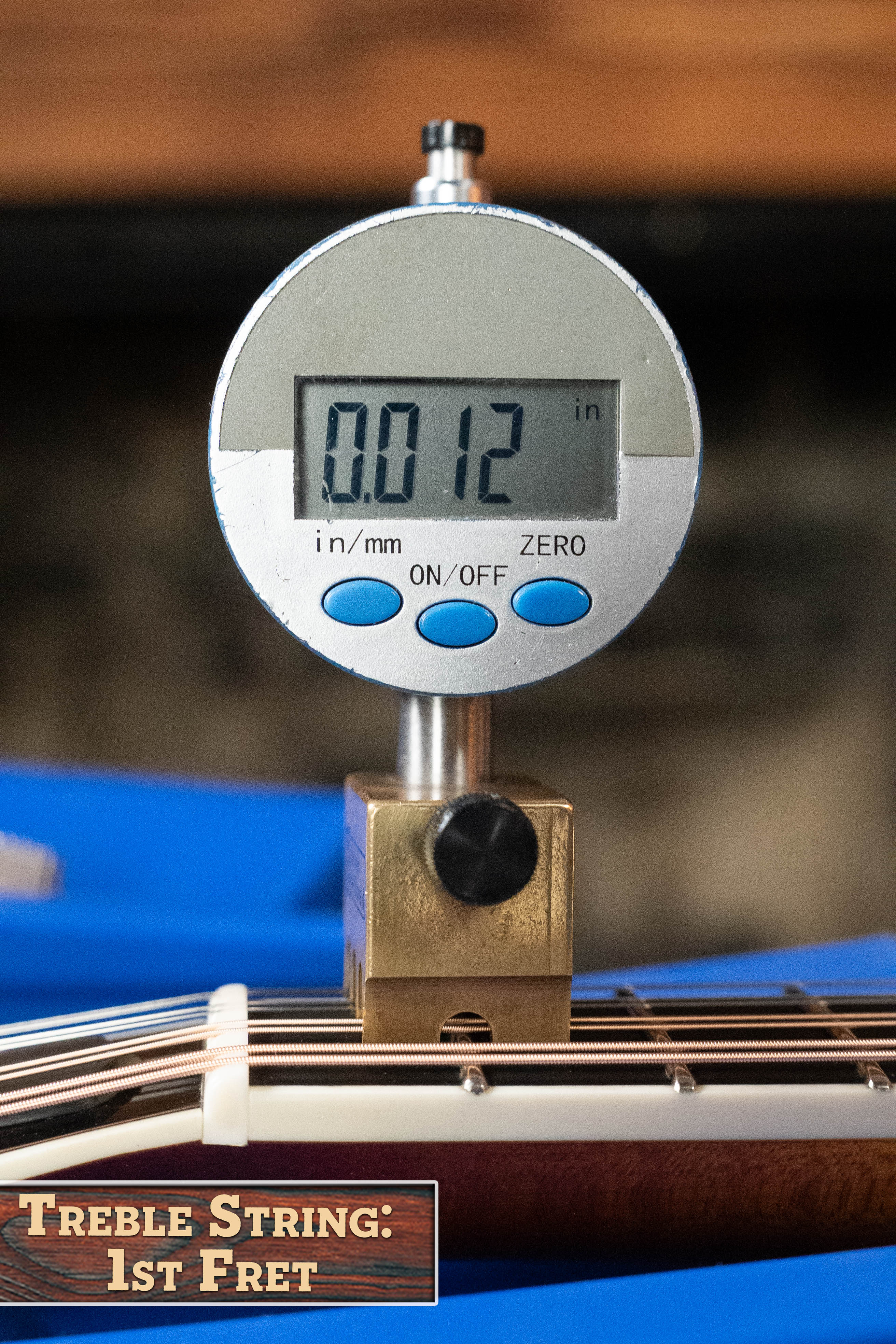 A digital gauge shows 0.012 inches over the first fret of a Bulas Carpathian Spruce/Curly Maple Cremona Sunburst A-Style Mandolin #8129. "Treble String: 1st Fret" appears in the corner.