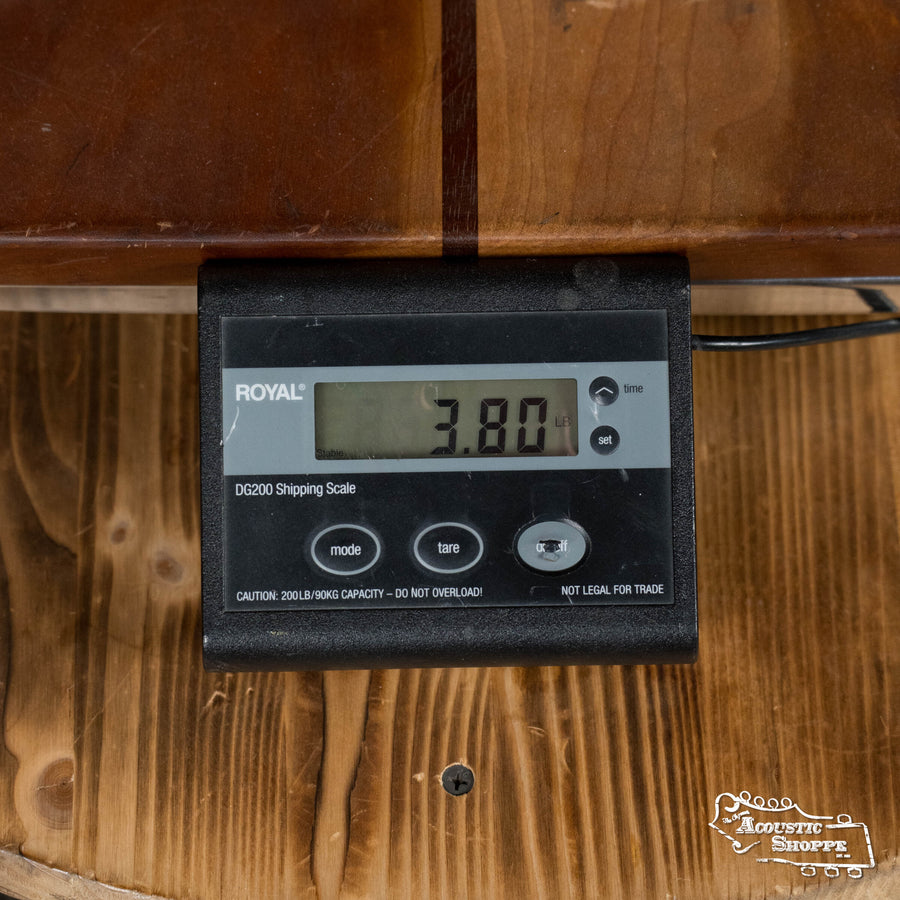 A digital shipping scale on wood shows a weight of 3.80 lbs—ideal for weighing your Iris Guitars IRIS DF *Custom* Guild Sitka/Old Mahogany Burst Slope Shoulder Dreadnought Guitar #1044. The ROYAL DG200 scale features mode and tare buttons.
