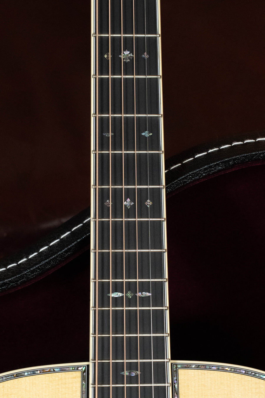 Close-up of Martin D-42 acoustic guitar fretboard with intricate mother-of-pearl inlays on dark wood. - *Dread-Not Certified Used*  Martin D-42 Spruce/East Indian Rosewood Dreadnought Acoustic Guitar #8810 - Default Title