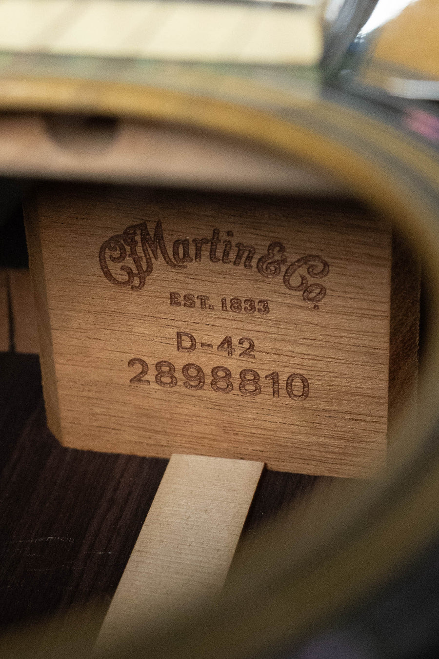 Close-up of Martin D-42 acoustic guitar label inside soundhole showing model number and serial number. - *Dread-Not Certified Used*  Martin D-42 Spruce/East Indian Rosewood Dreadnought Acoustic Guitar #8810 - Default Title