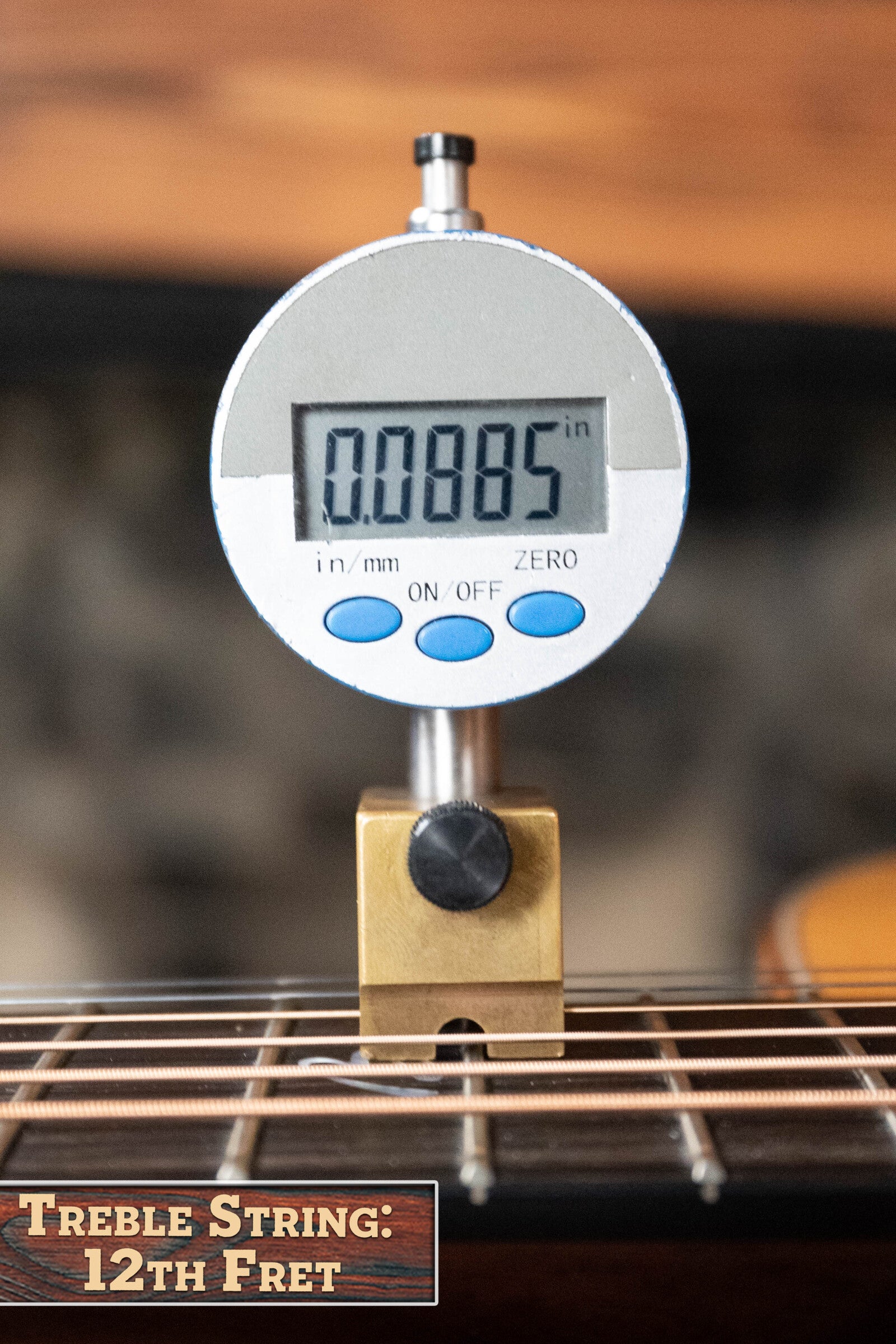 A digital gauge shows 0.0885 while measuring the treble string height at the 12th fret on a *Dread-Not Certified Used* Boucher BG-52-GM Bluegrass Goose Series Dreadnought (#1339) by Boucher Guitars; label: Treble String: 12th Fret.
