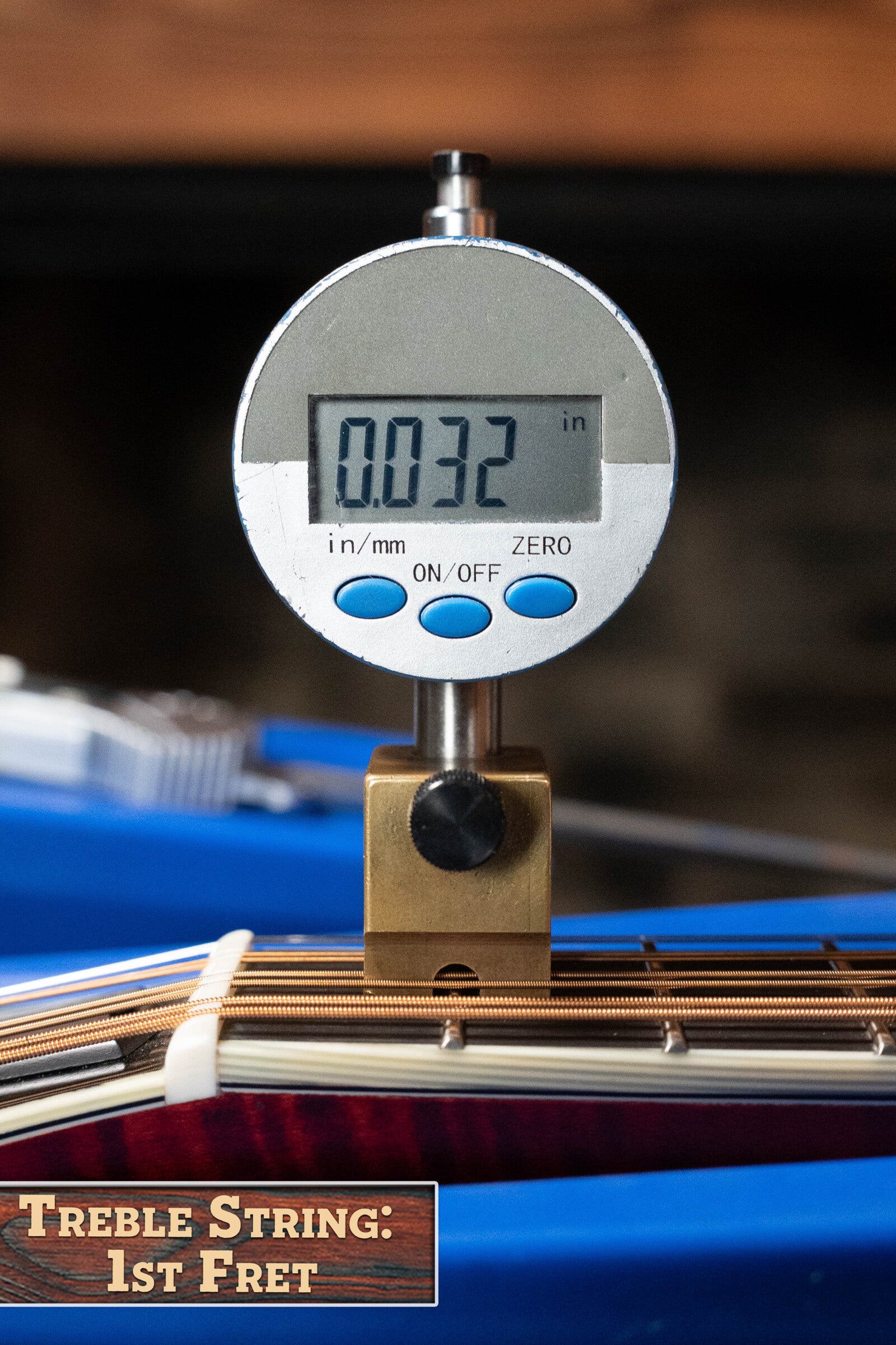 A digital gauge reads 0.032 inches, showing the Treble String height at the 1st fret of a *Dread-Not Certified Used* Eastman Guitars MDA815 F-Style Mandola Classic Finish #4978; both the solid spruce top and tool are clearly visible.