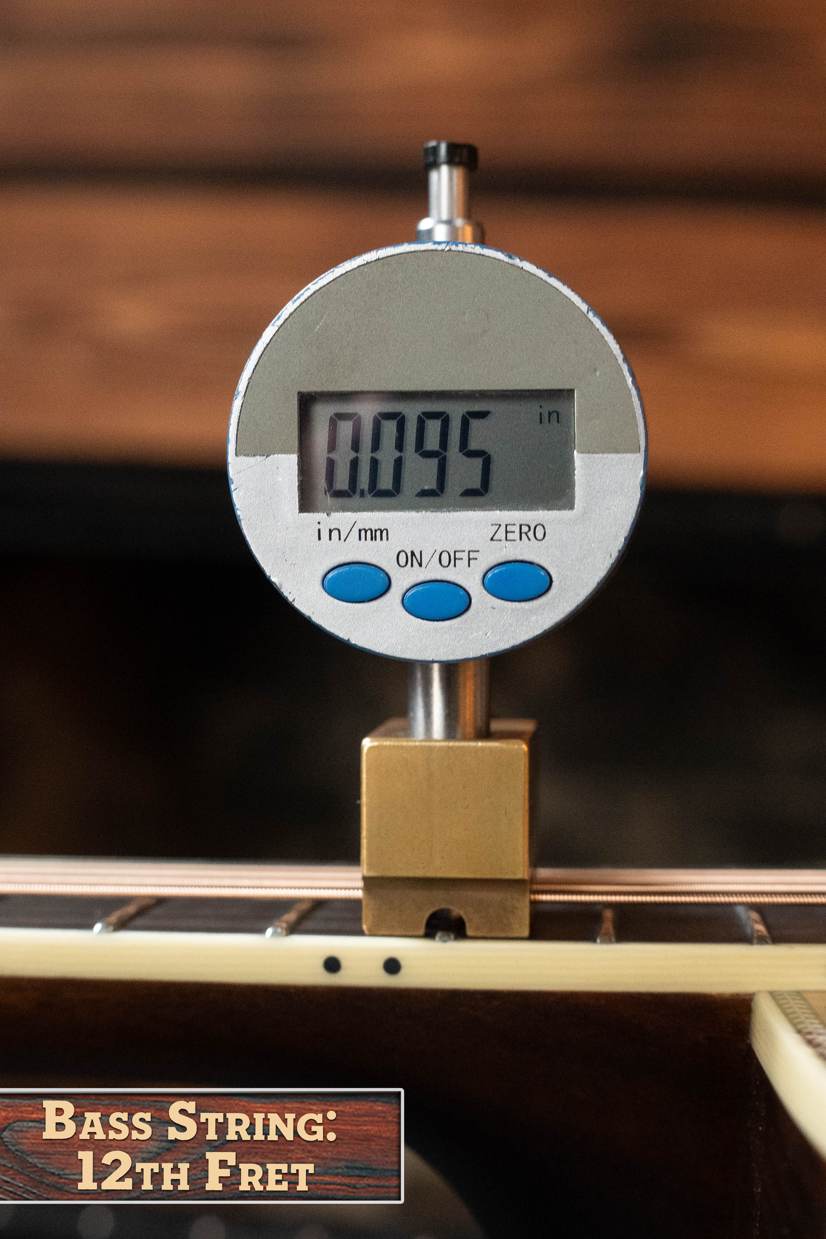 A digital gauge reads 0.095 inches while measuring the bass string height at the 12th fret on an Eastman Guitars E20D-LSH-TC Thermo-Cured Adirondack/Rosewood Large Soundhole Dreadnought Acoustic Guitar #3917.
