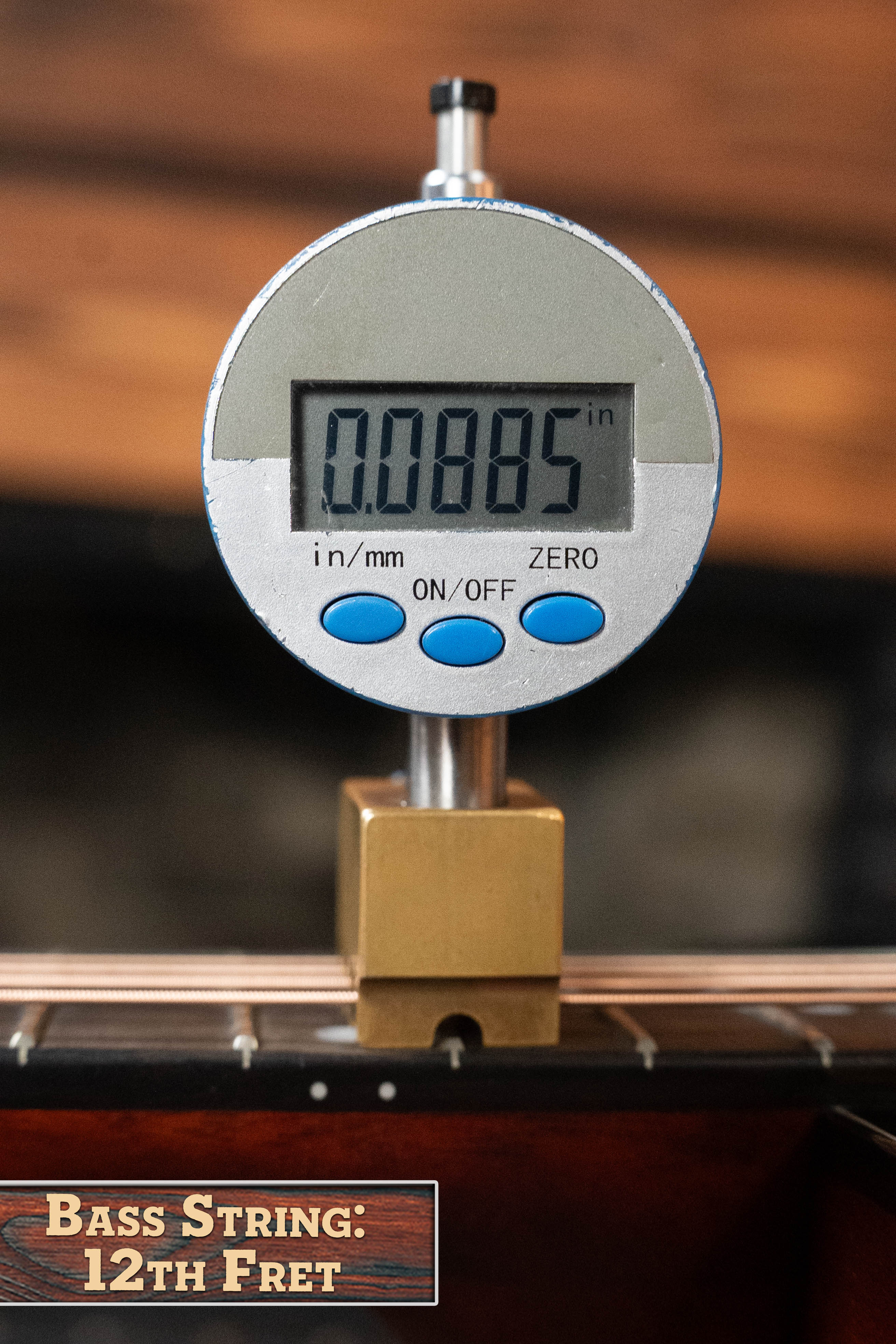A digital gauge shows a bass string height of 0.0885" at the 12th fret—ideal setup for your Eastman Guitars E2D-DLX-SB Cedar/Sapele Sunburst Dreadnought w/Fishman Pickup #1532 or any favorite instrument.
