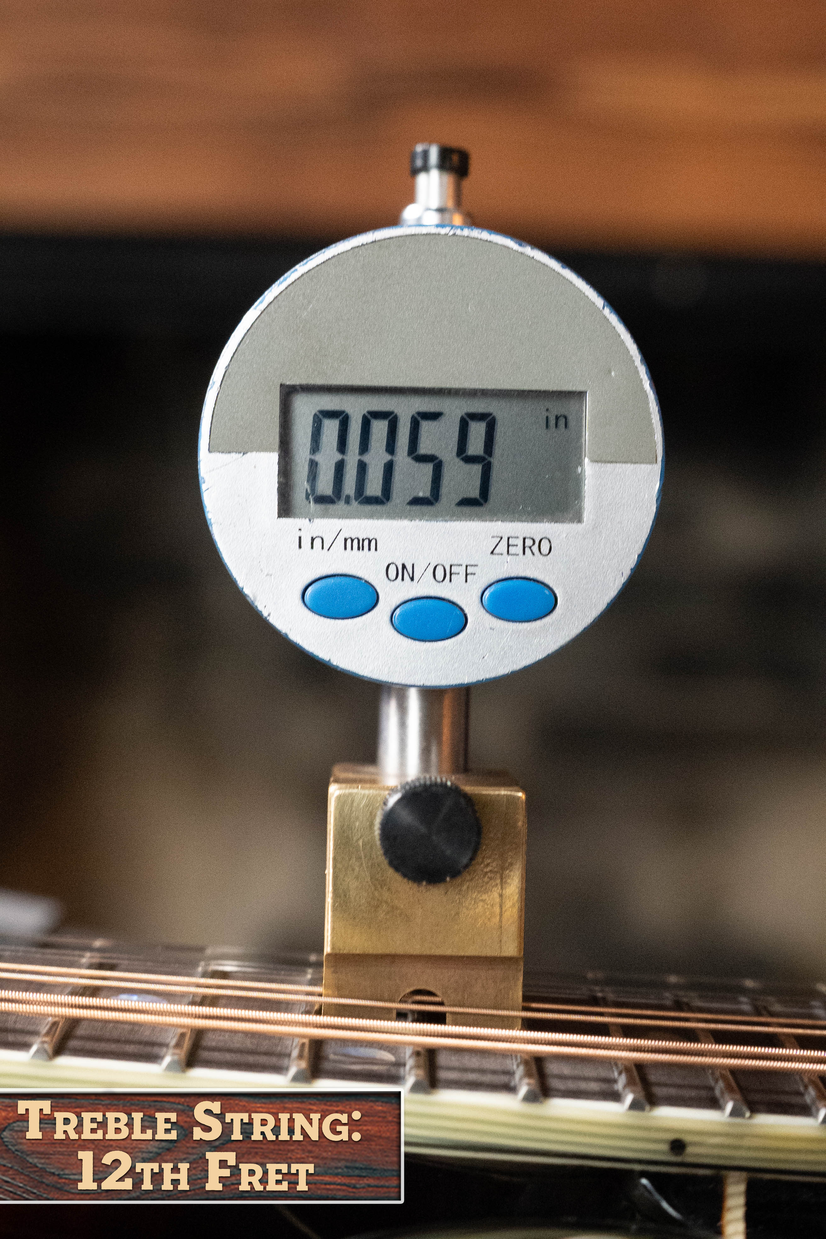 A digital gauge shows a treble string height of 0.059" at the 12th fret on an Eastman Guitars MD815-SB Adirondack/Flamed Maple Sunburst F-Style Mandolin #3356. The label reads: Treble String: 12th Fret.