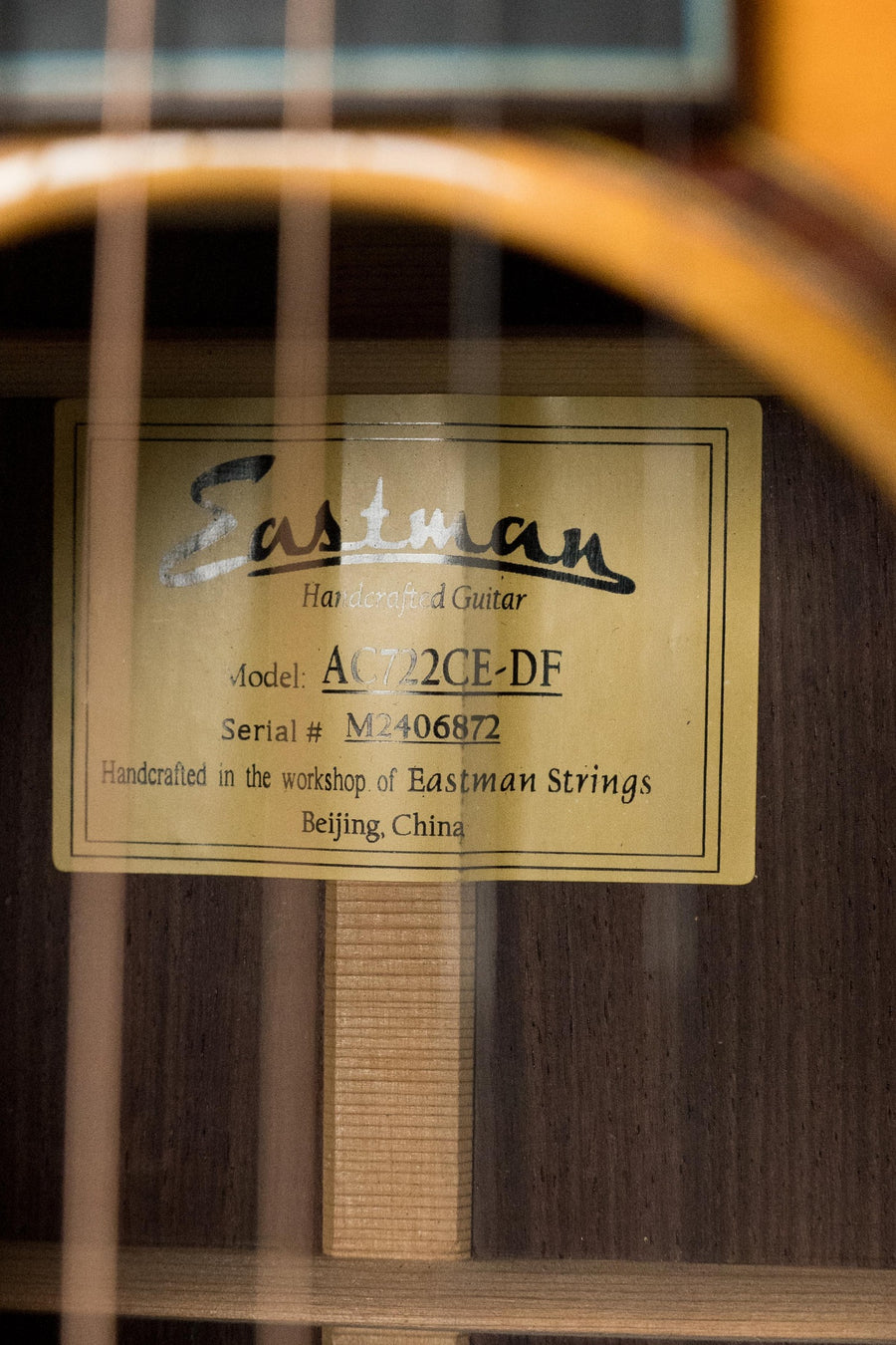 Close-up of Eastman acoustic guitar label inside soundhole showing model AC722CE-DF and Dakota Fade finish. - Eastman AC722CE-DF European Spruce/Rosewood Dakota Fade Finish Grand Auditorium  w/ LR Baggs Pickup #6872 - Default Title