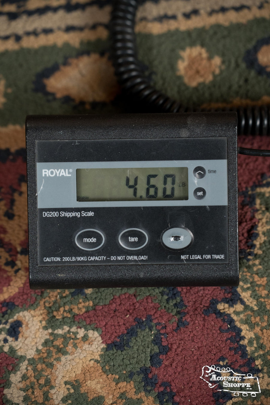 Digital chromatic tuner displaying 4.60 along with control buttons on a multicolored rug. - (Used) Eastman E1OM-DLX All Solid Sitka/Sapele Guitar w/K&K Pickup #8865 - Default Title