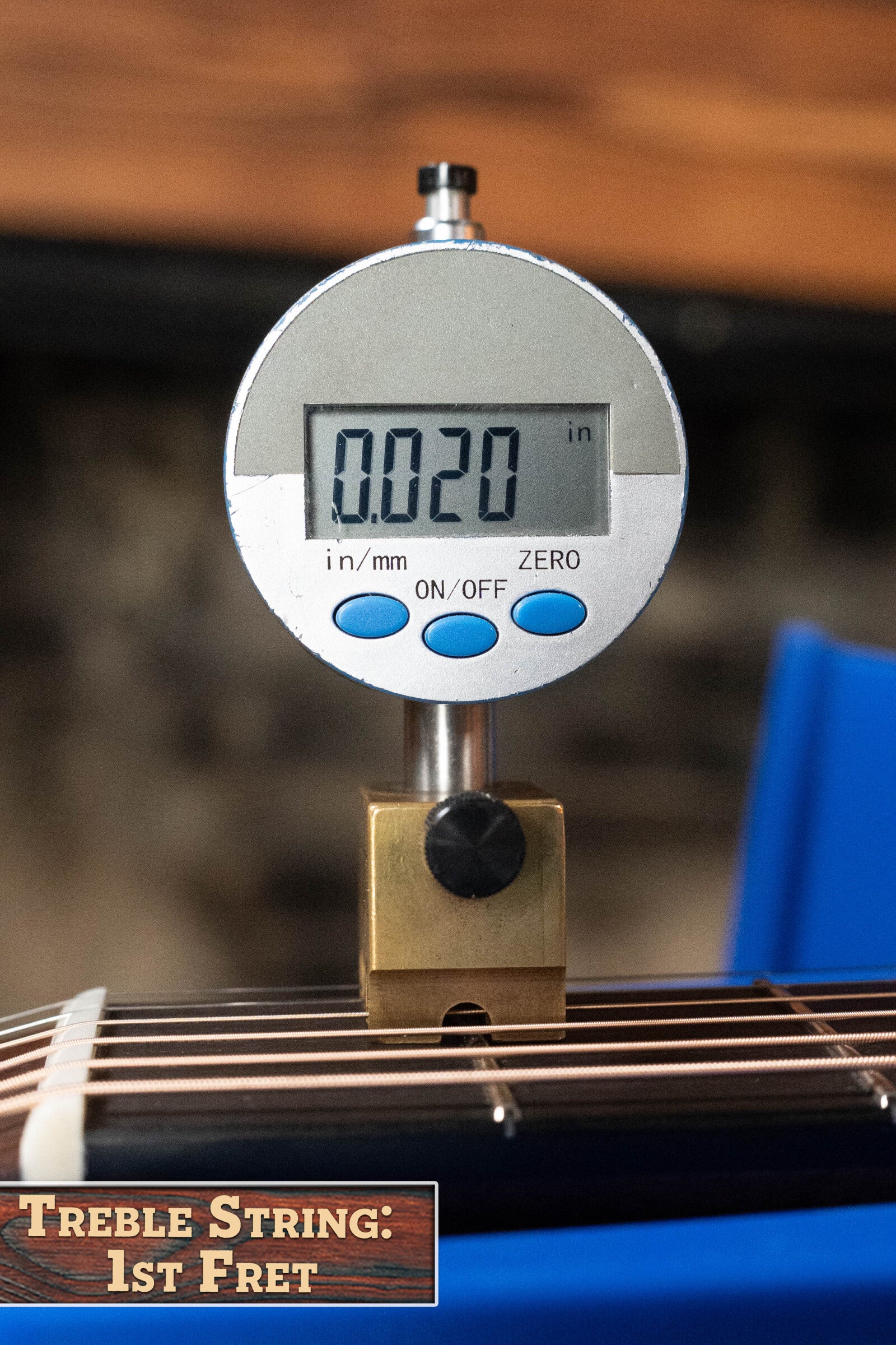 A digital gauge shows the treble string height at the 1st fret of an Eastman Guitars E20D-TC Thermo-Cured Adirondack/Rosewood Dreadnought Acoustic Guitar #8128 as 0.020 inches, with a label noting its Adirondack Spruce top.