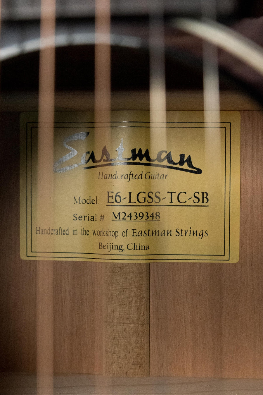 Label inside acoustic guitar body showing Eastman model E6-LGSS-TC-SB with serial number M2419348. - Eastman E6-LGSS-TC-SB Thermo-Cured Sitka/Mahogany LG-Style Slope Shoulder Sunburst Acoustic Guitar #9348 - Default Title