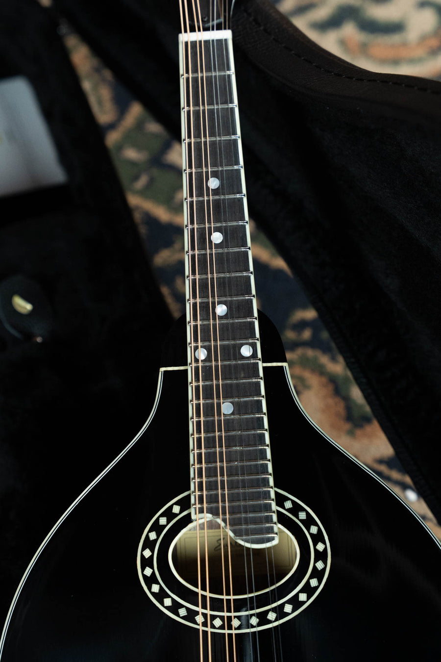 Black A-style mandolin with oval sound hole, pearl dot inlays on fretboard, and decorative rosette around sound hole. - Eastman MD404-BK Black Top Oval Hole A-Style Mandolin #0083 - Default Title