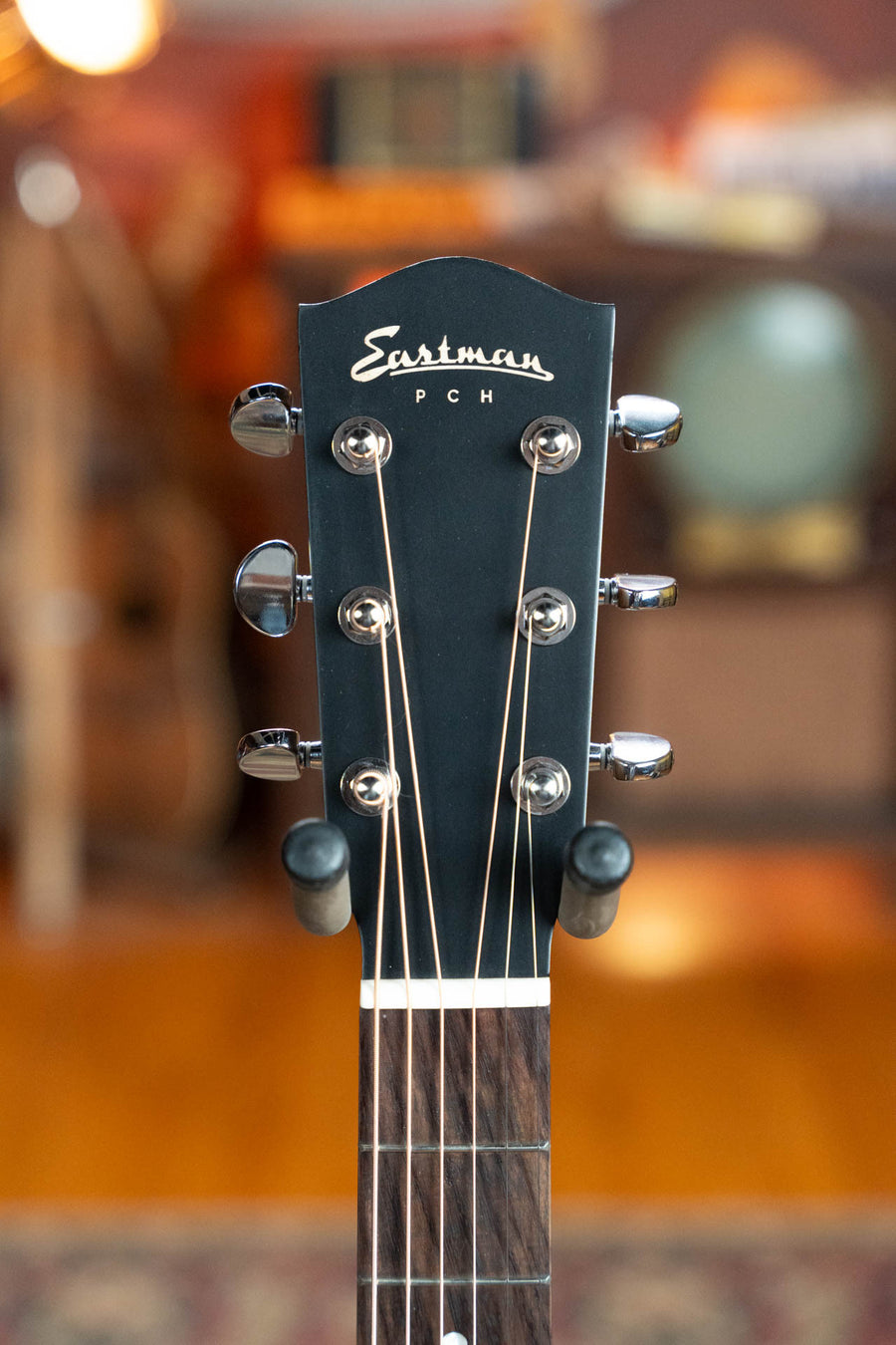 Black Eastman PCH2-OM acoustic guitar headstock with chrome tuning pegs and white logo. - Eastman PCH2-OM-BK Solid Thermo-Cured Sitka/Laminated Rosewood Orchestra Model Gloss Black Top Acoustic Guitar #1078 - Default Title