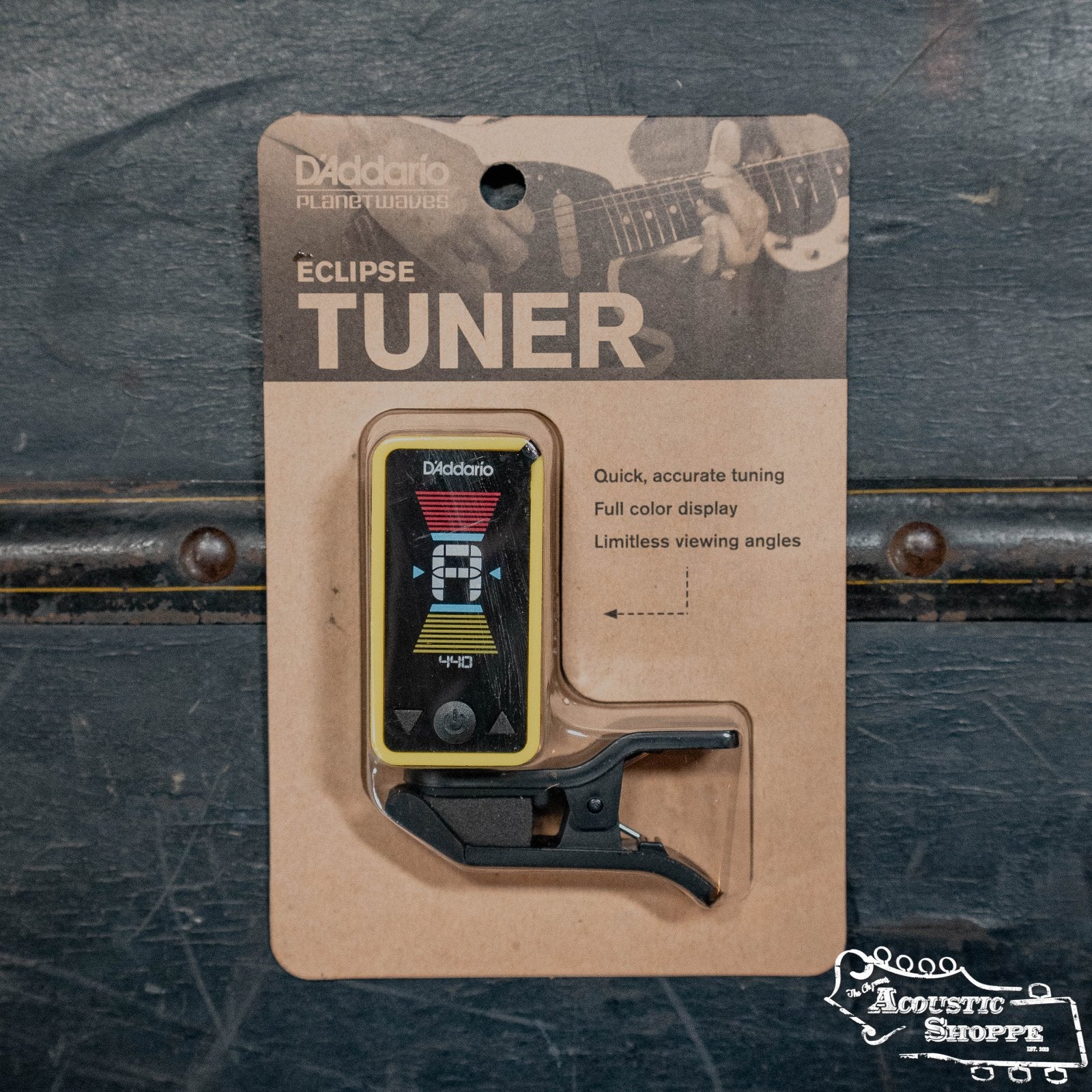 The D'Addario Eclipse Headstock Tuner, shown in its packaging with a digital full-color display, offers fast, accurate tuning and adjustable viewing angles. The Acoustic Shoppe logo is visible in the corner.