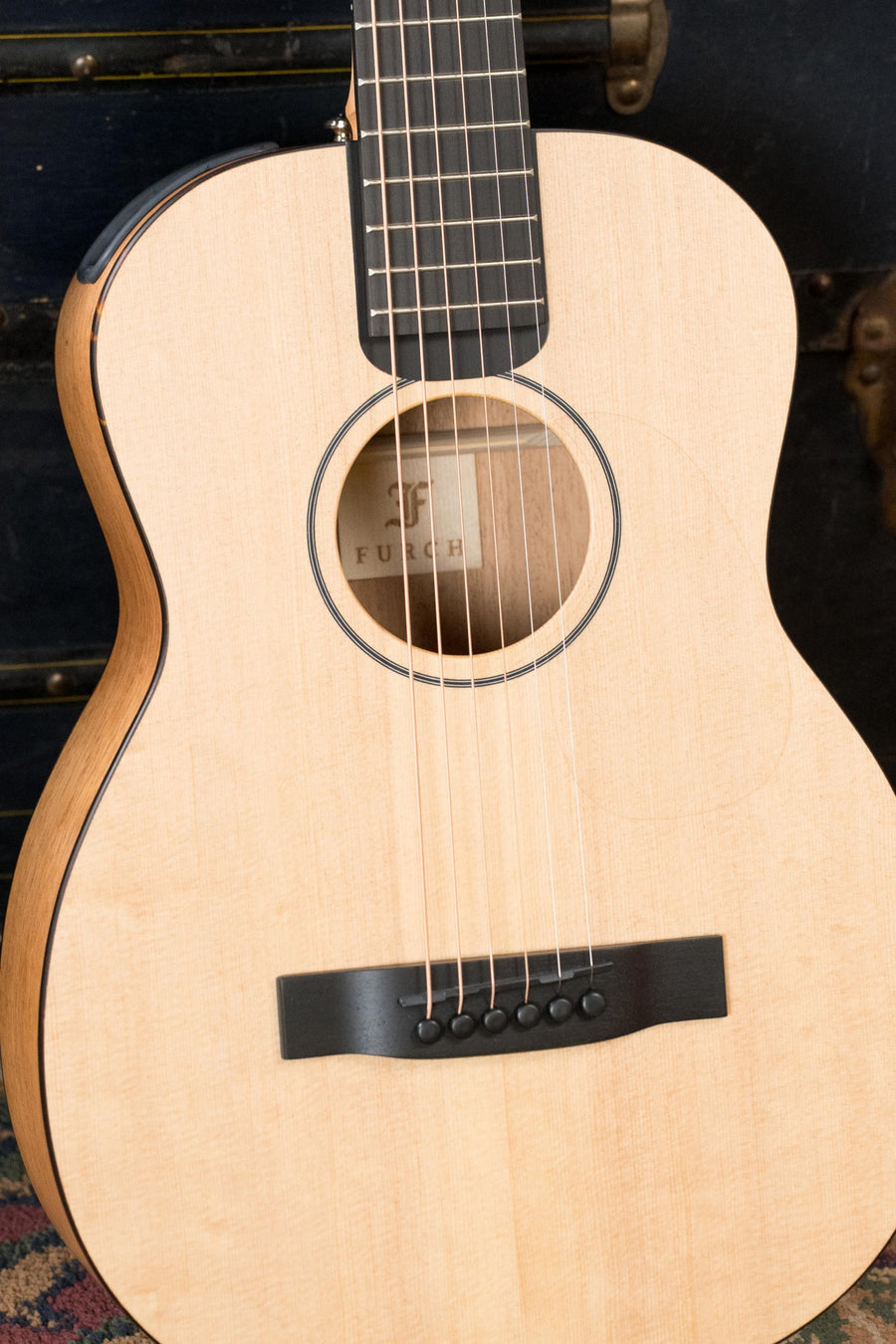 Foldable acoustic guitar with light Sitka spruce top and dark mahogany neck, black bridge and fretboard, close-up view. - Furch Little Jane Sitka/Mahogany Foldable Travel Acoustic Guitar #0654 - Default Title