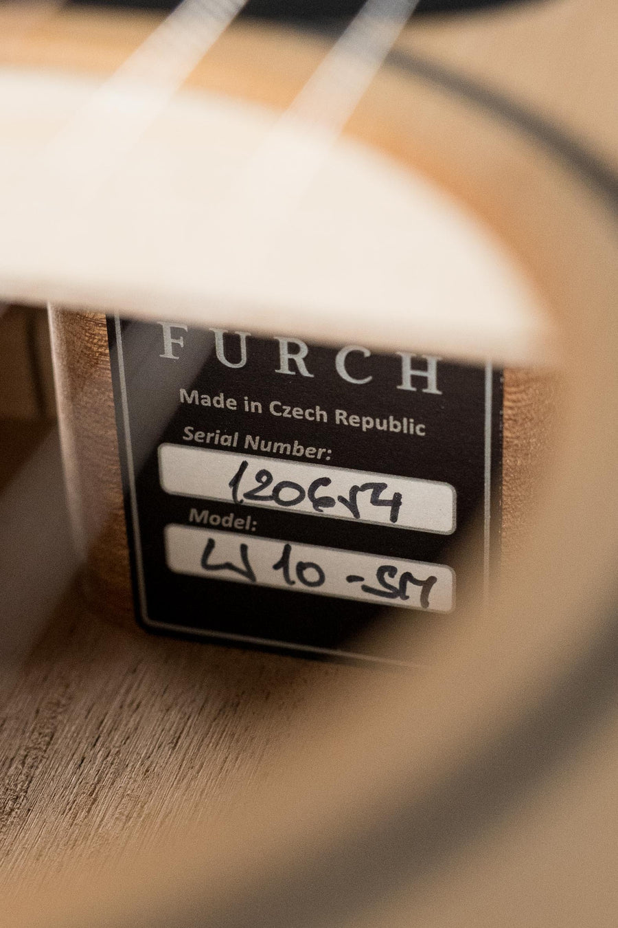Close-up of Furch Little Jane acoustic guitar label showing model number and serial details inside soundhole. - Furch Little Jane Sitka/Mahogany Foldable Travel Acoustic Guitar #0654 - Default Title