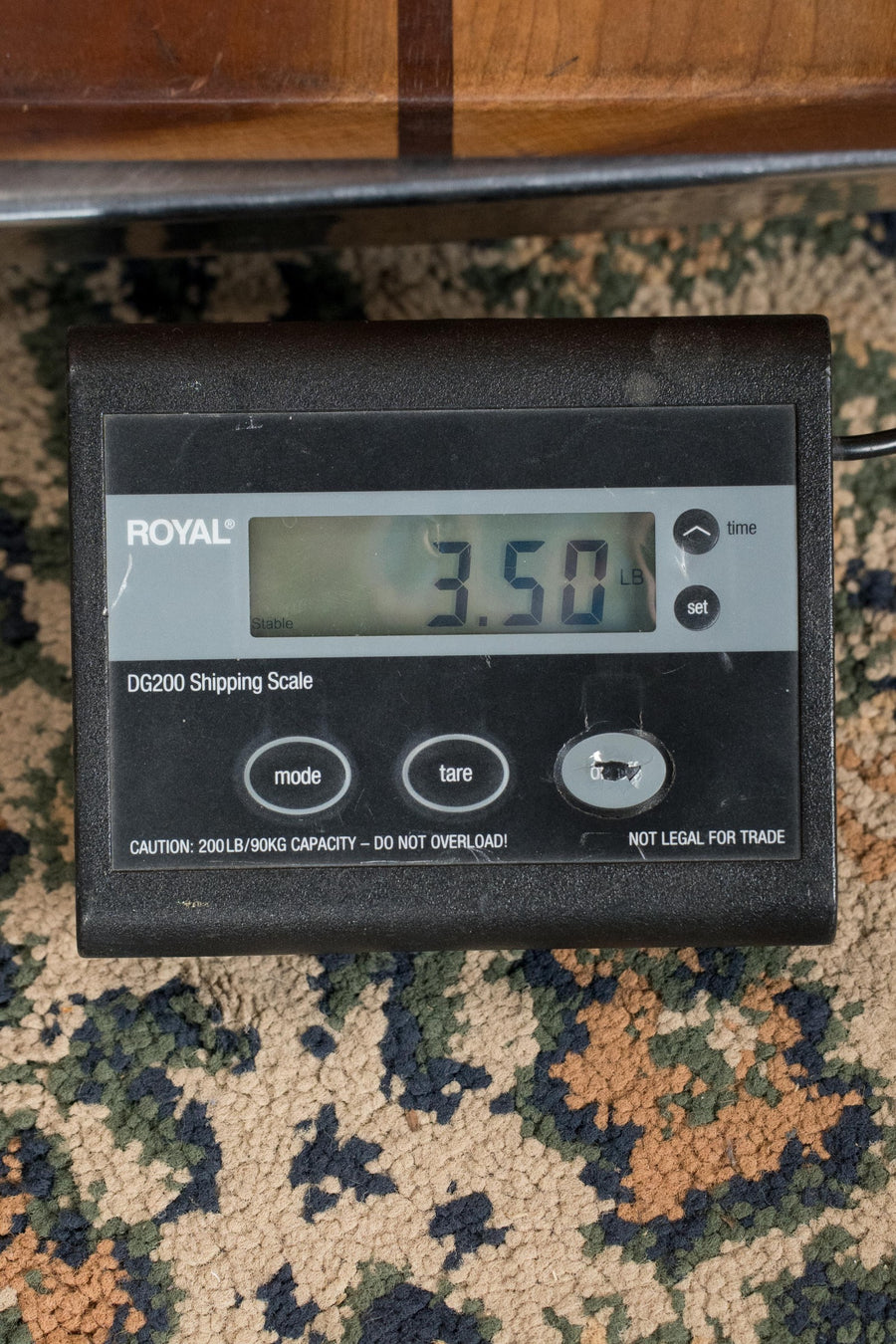 Digital shipping scale displaying a weight of 3.50 pounds on a carpeted floor. - Furch Little Jane Sitka/Mahogany Foldable Travel Acoustic Guitar #0654 - Default Title