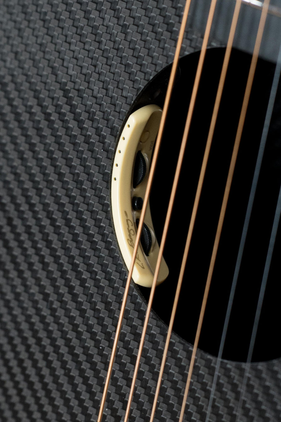 Close-up of full carbon guitar body showing grand cutaway, carbon fiber texture, and LR Baggs pickup ring with guitar strings. - KLOS X_GC_DAE Full Carbon Grand Cutaway Guitar w/LR Baggs Pickup #2081 - Default Title
