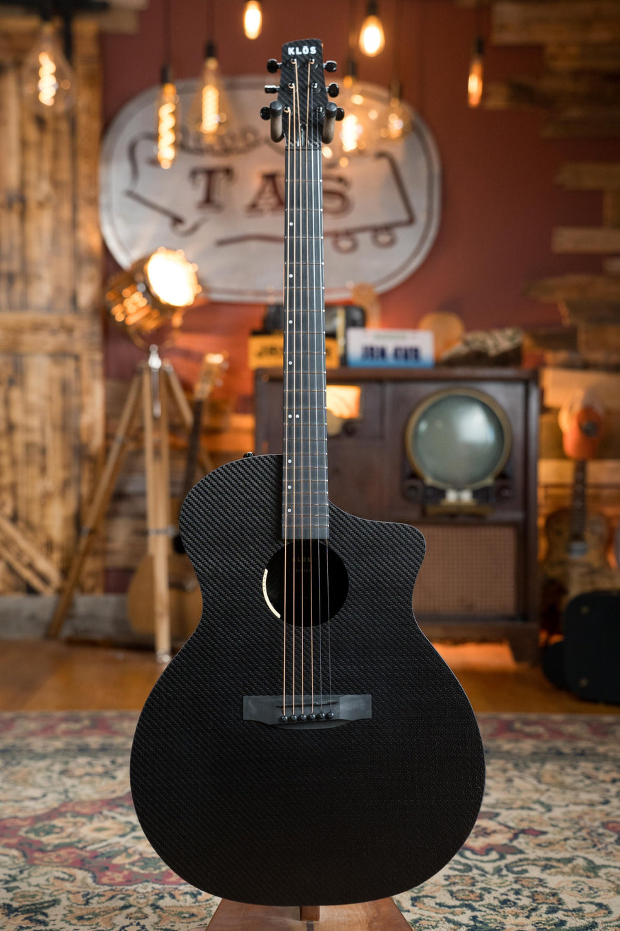Full black carbon fiber acoustic guitar with grand cutaway body and glossy finish on patterned rug. - KLOS X_GC_DAE Full Carbon Grand Cutaway Guitar w/LR Baggs Pickup #2081 - Default Title
