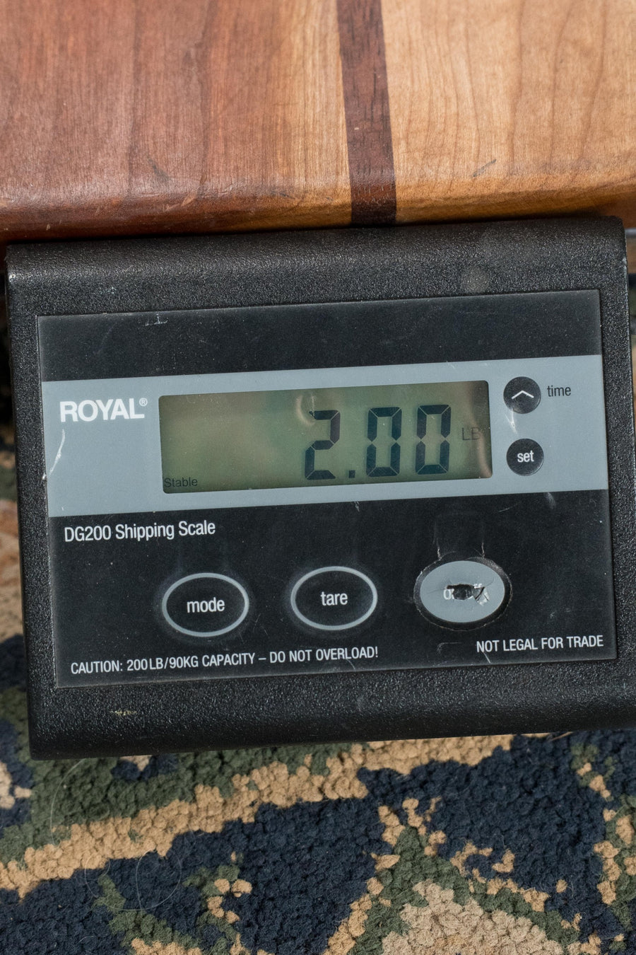 Digital shipping scale displaying 2.00 pounds with wooden surface above it and patterned carpet below. - KLOS X_U_BAR_DA All Carbon Baritone Ukulele #2393 - Default Title