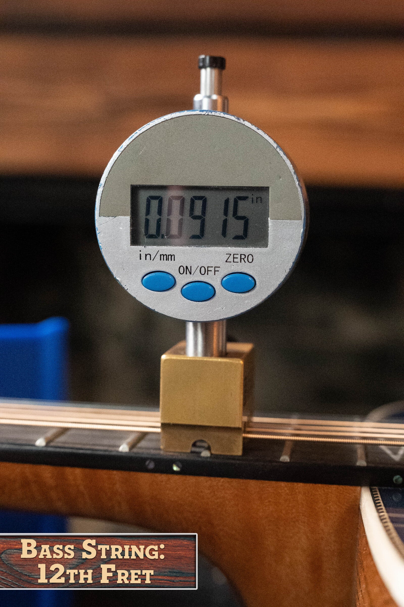 A digital caliper reads 0.0915 inches, measuring the bass string height at the 12th fret with a "Bass String: 12th Fret" sign on a *Limited Edition* Martin & Co. CEO-11 European Spruce/White Oak Grand Auditorium Guitar #1204.