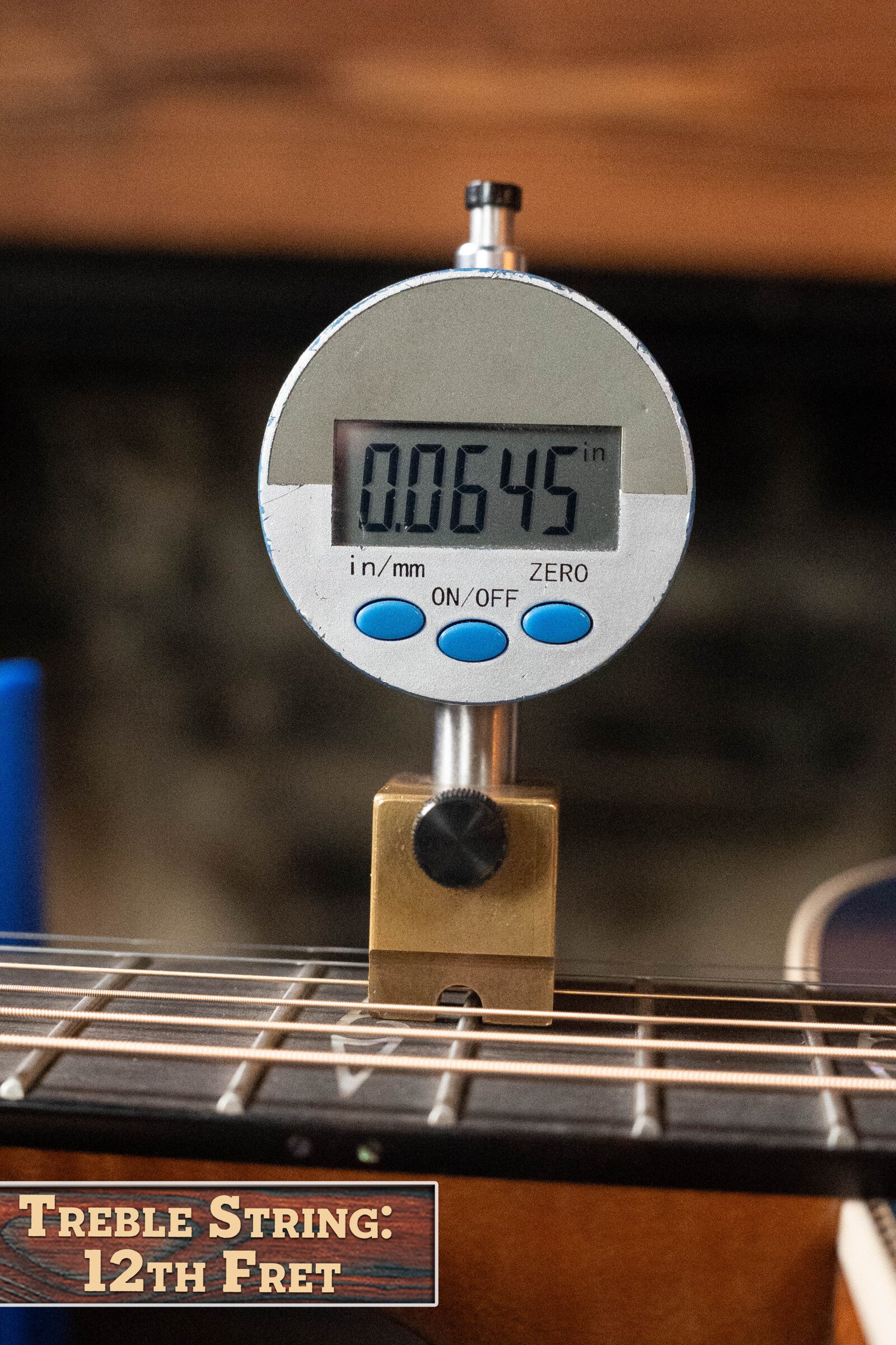 A digital caliper reads 0.0645 inches at the 12th fret (Treble String) of a Martin & Co. *Limited Edition* CEO-11 European Spruce/White Oak New Horizons Blue Burst Grand Auditorium Guitar w/Electronics #1204.