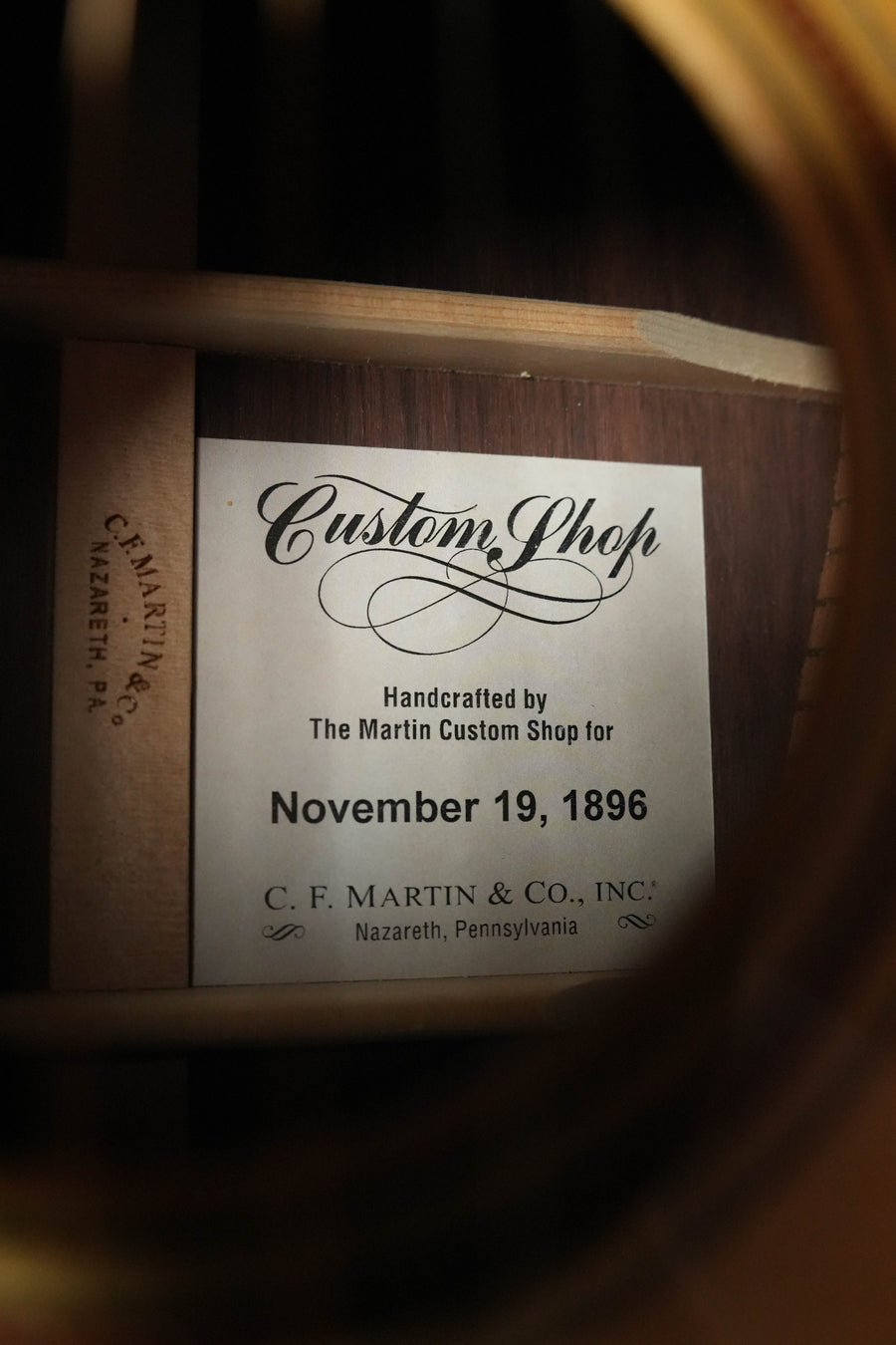 Close-up of the label inside the soundhole of a Martin & Co. Custom Shop Sitka/Rosewood Acoustic Guitar #6904, handcrafted in Nazareth, PA with fine VTS Sitka spruce and dated November 19, 1896.