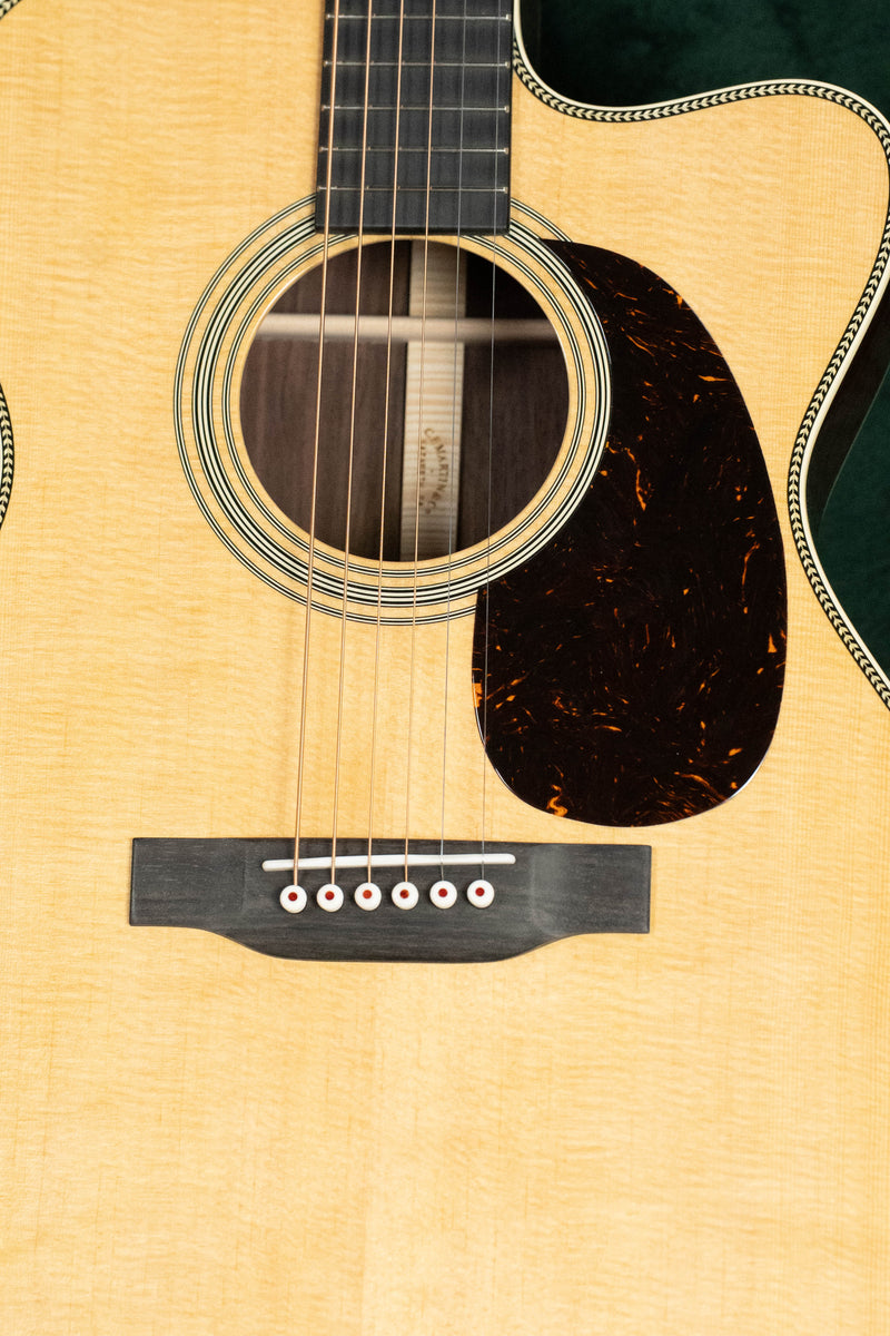 Martin Custom Shop OOO/OM Custom: front view, light-colored spruce top and cocobolo back and sides.