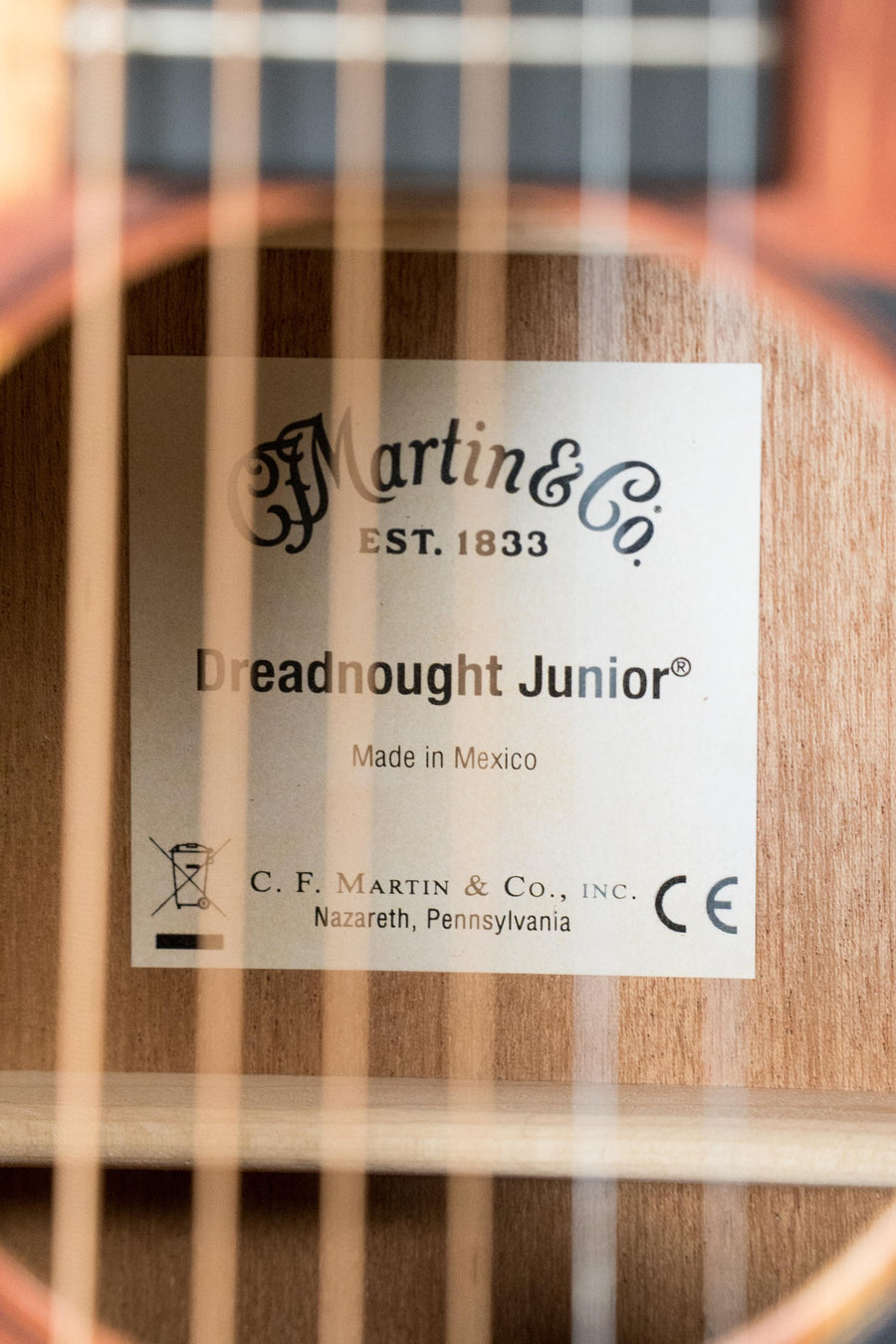 Close-up of a Martin & Co. EST. 1833 label inside the *New 2025 Model* D Jr E Streetlegend Burst Spruce/Sapele Aged-Look Dreadnought Guitar w/Martin Electronics #3866, capturing its vintage-inspired acoustic appeal.