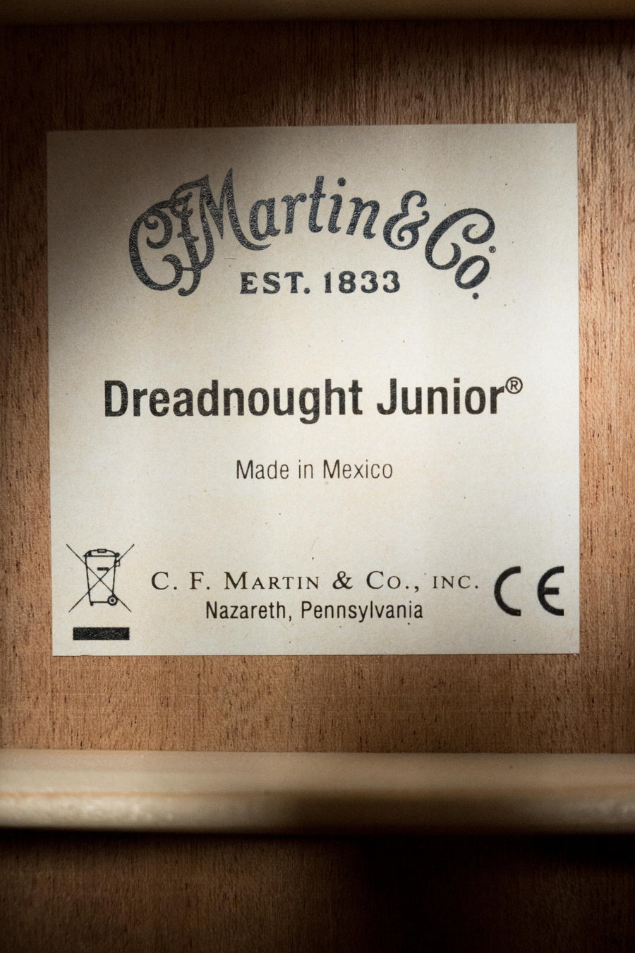 Close-up of the label inside a Martin & Co. *New 2025 Model* D Jr E Streetlegend Burst Spruce/Sapele Aged-Look Dreadnought Guitar w/Martin Electronics #3868, showcasing vintage-inspired craftsmanship.