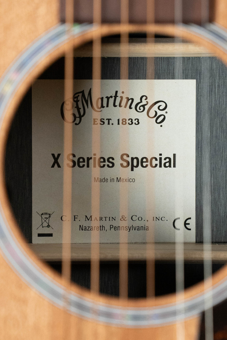 Close-up of Martin GP-X2E guitar label through soundhole showing X Series Special text and strings in foreground. - Martin GP-X2E Sapele/HPL Ziricote Grand Performance Guitar w/Martin Electronics #6110 - Default Title