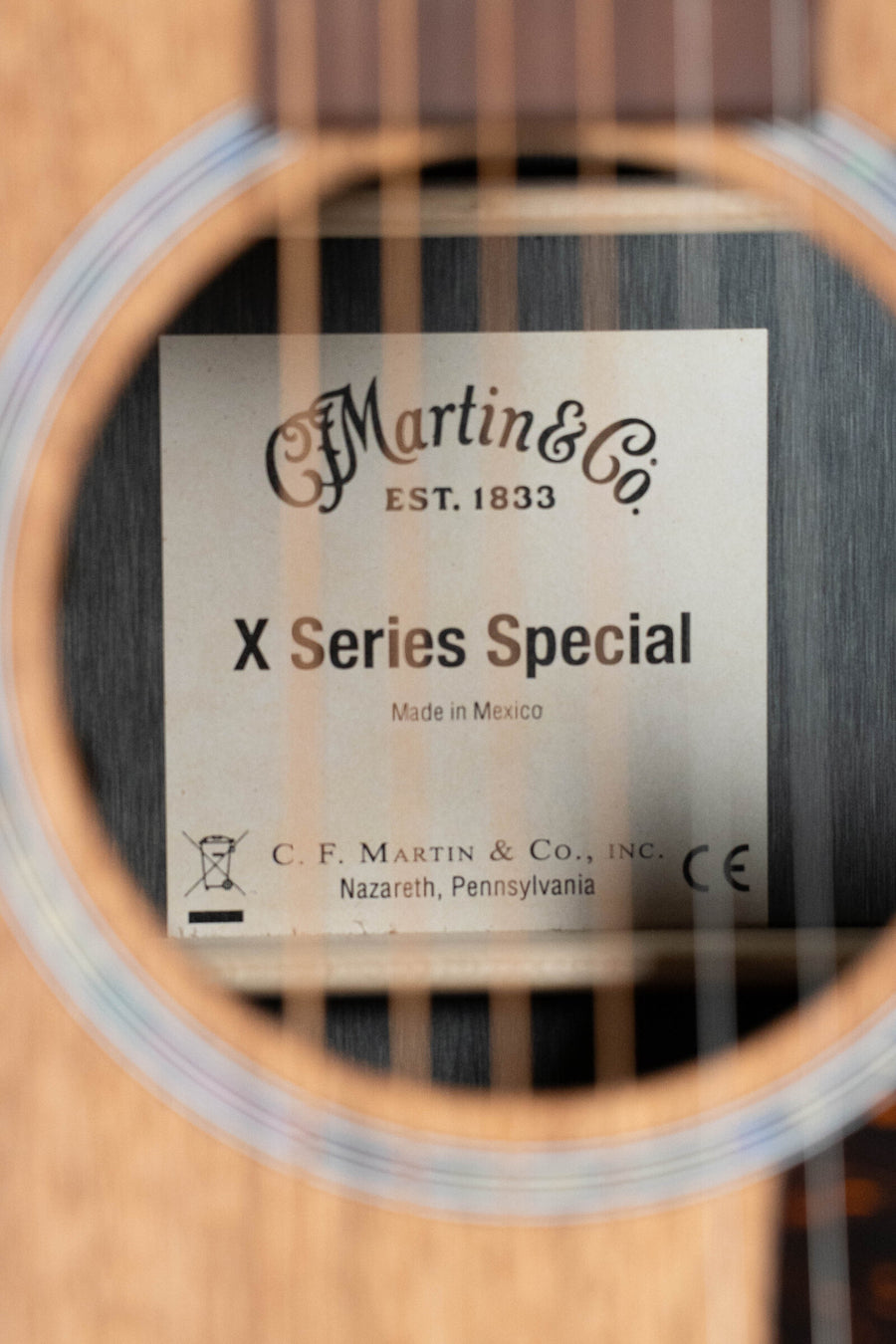 Martin OMC-X2E cutaway acoustic guitar with ziricote finish and soundhole label reading "X Series Special". - Martin OMC-X2E All HPL Ziricote OM Cutaway Guitar w/Martin Electronics #8900 - Default Title