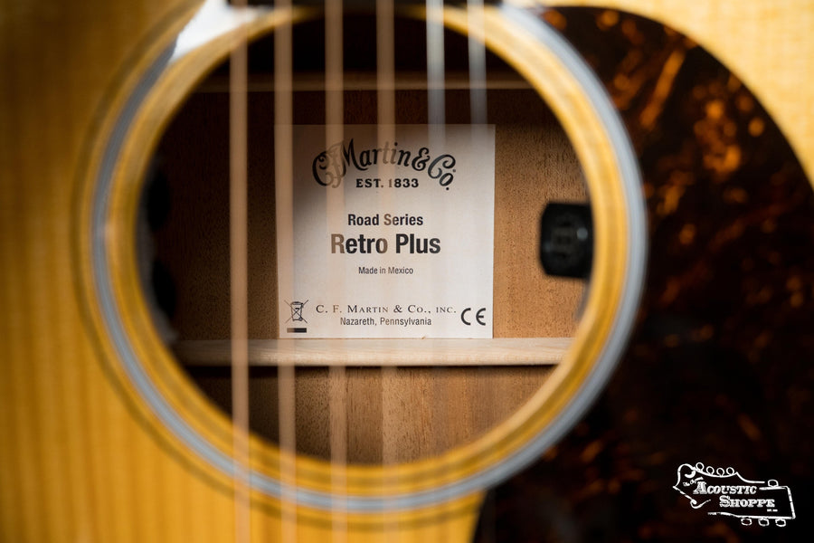 Close-up of Martin OOOE Retro Plus guitar soundhole showing torrefied spruce top, tortoiseshell pickguard, and Martin. - Martin OOOE Retro Plus Torrefied Spruce/Mahogany OOO Guitar w/Martin Electronics #2988 - Default Title