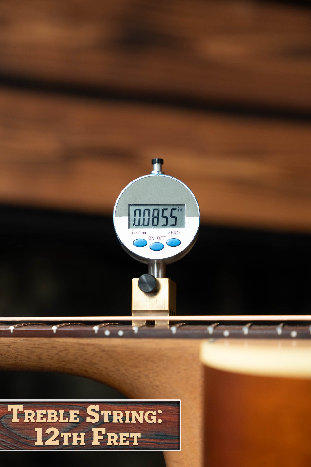 A digital gauge shows the treble string action at the 12th fret as 0.0855 inches on a Maton Guitars T.E. Personal Spruce/Queensland Maple Deep Body OO Guitar w/Electronics #0085. A label reads Treble String: 12th Fret, with neck and body visible.
