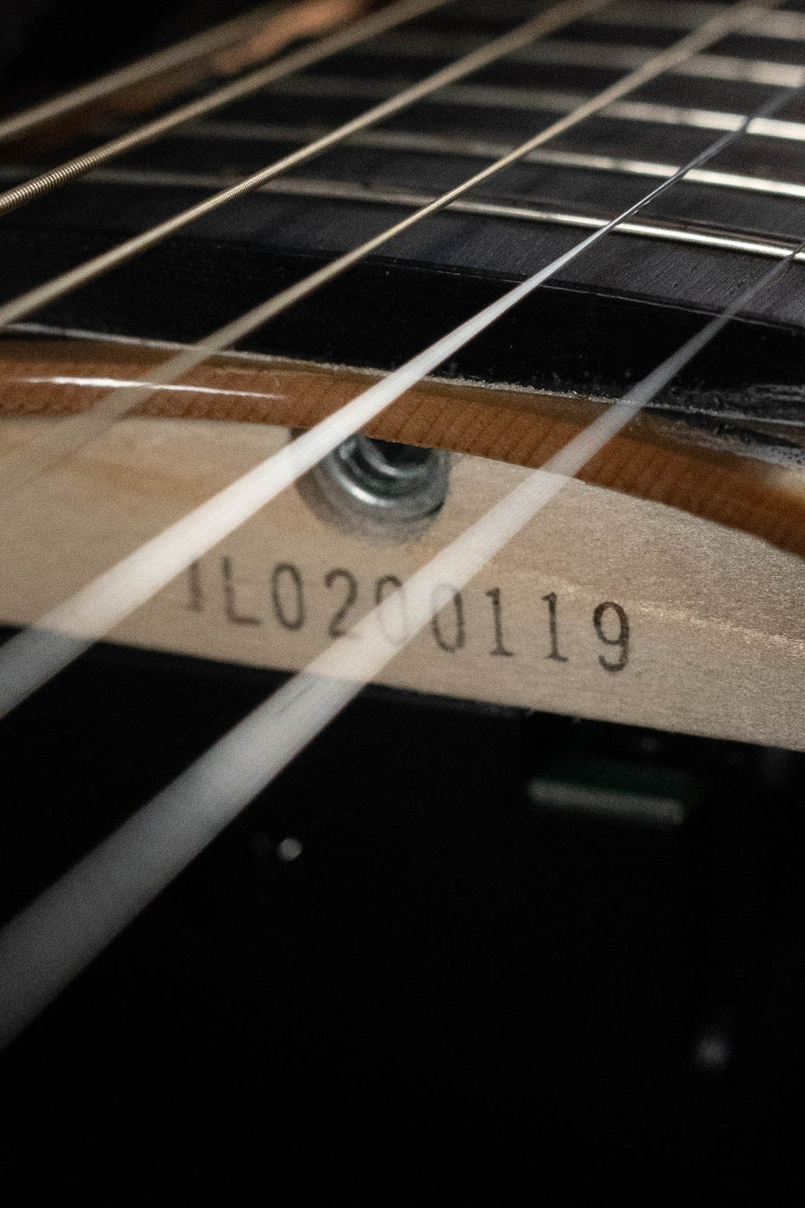 Close-up of Yamaha TAS3C-NT Concert Guitar (#0119) fretboard and strings, showing the solid Sitka spruce top texture and details near the neck joint. Features NEWEST TransAcoustic System on this latest 2026 model.