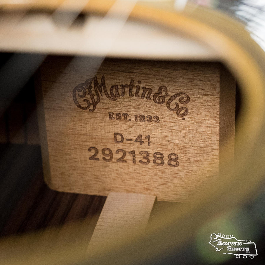 Close-up of the *New 2025 Model* Martin D-41 Spruce/Indian Rosewood Dreadnought Acoustic Guitar #1388 by Martin & Co.; the label is visible inside, along with strings and part of the guitar body.