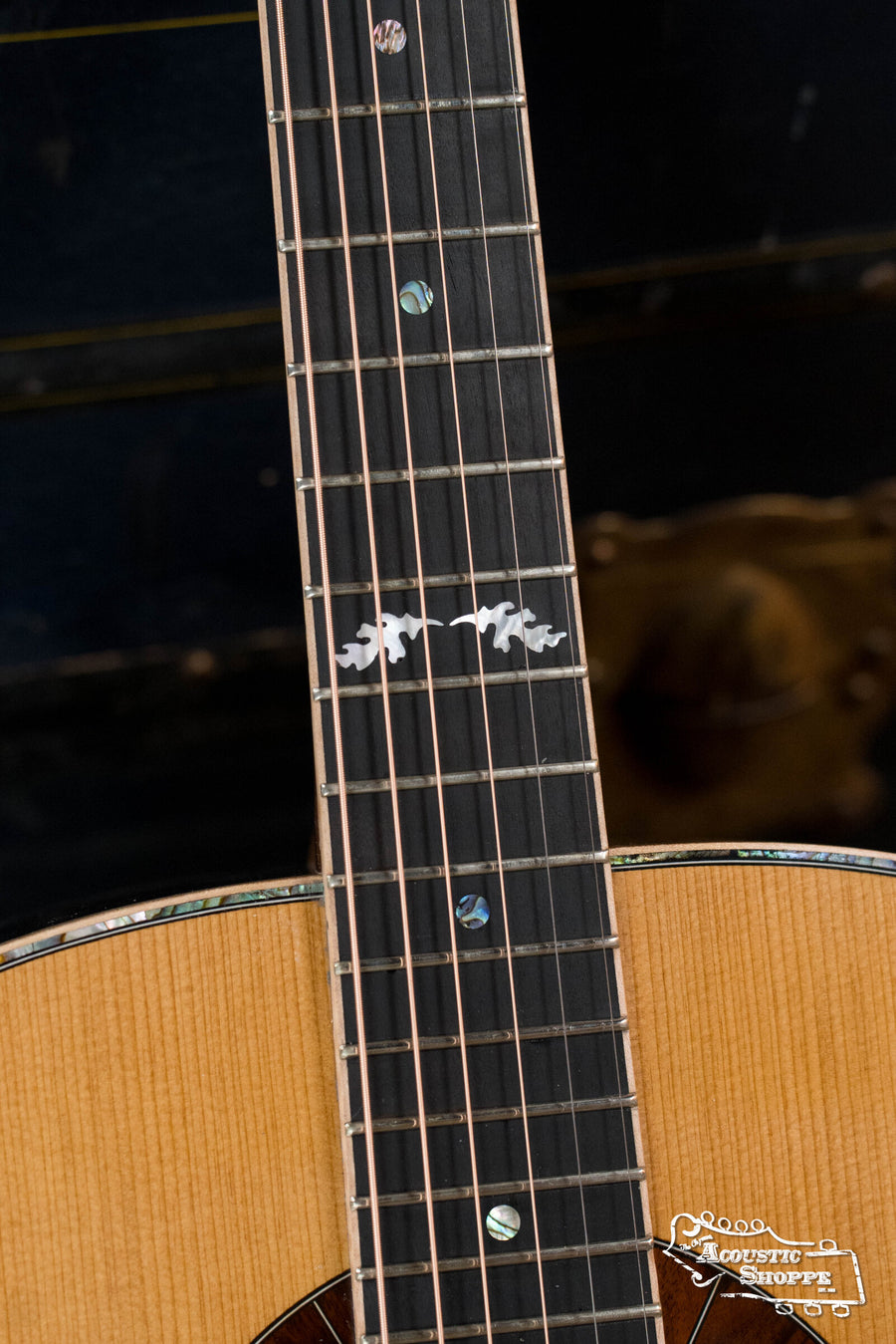 Close-up of the Squirrel Hunter Ornate Rosewood Dreadnought’s neck and fretboard with decorative bird inlays. Torrified Sitka spruce body, East Indian rosewood back, and shop logo complete this Local Luthier Showcase guitar.