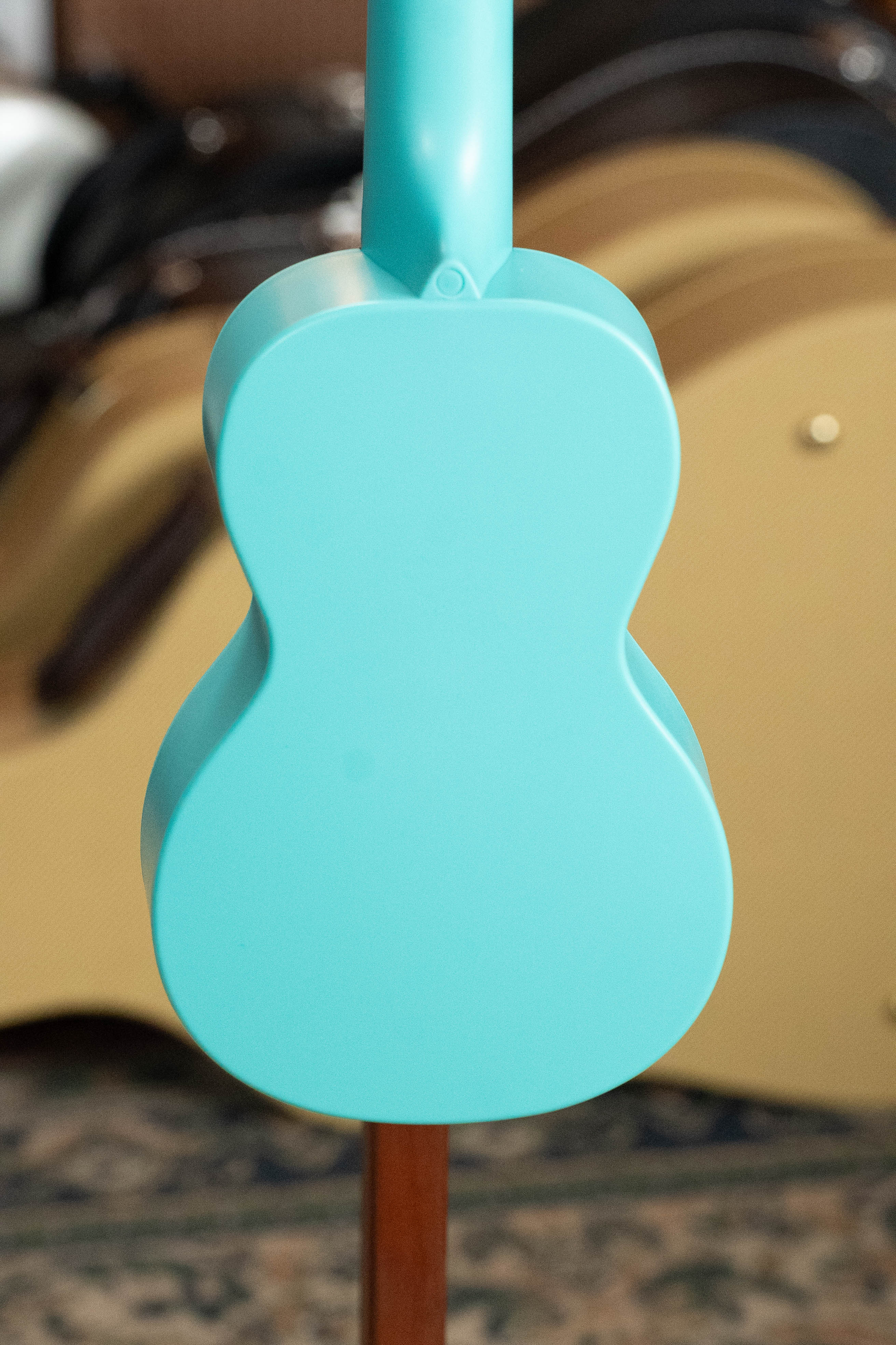 Aqua blue soprano ukulele with smooth, glossy finish and curved body facing backwards. - The Waterman Aqua Mist Glow-In-The-Dark Soprano Recycled Ukulele - Kala Brand - Default Title