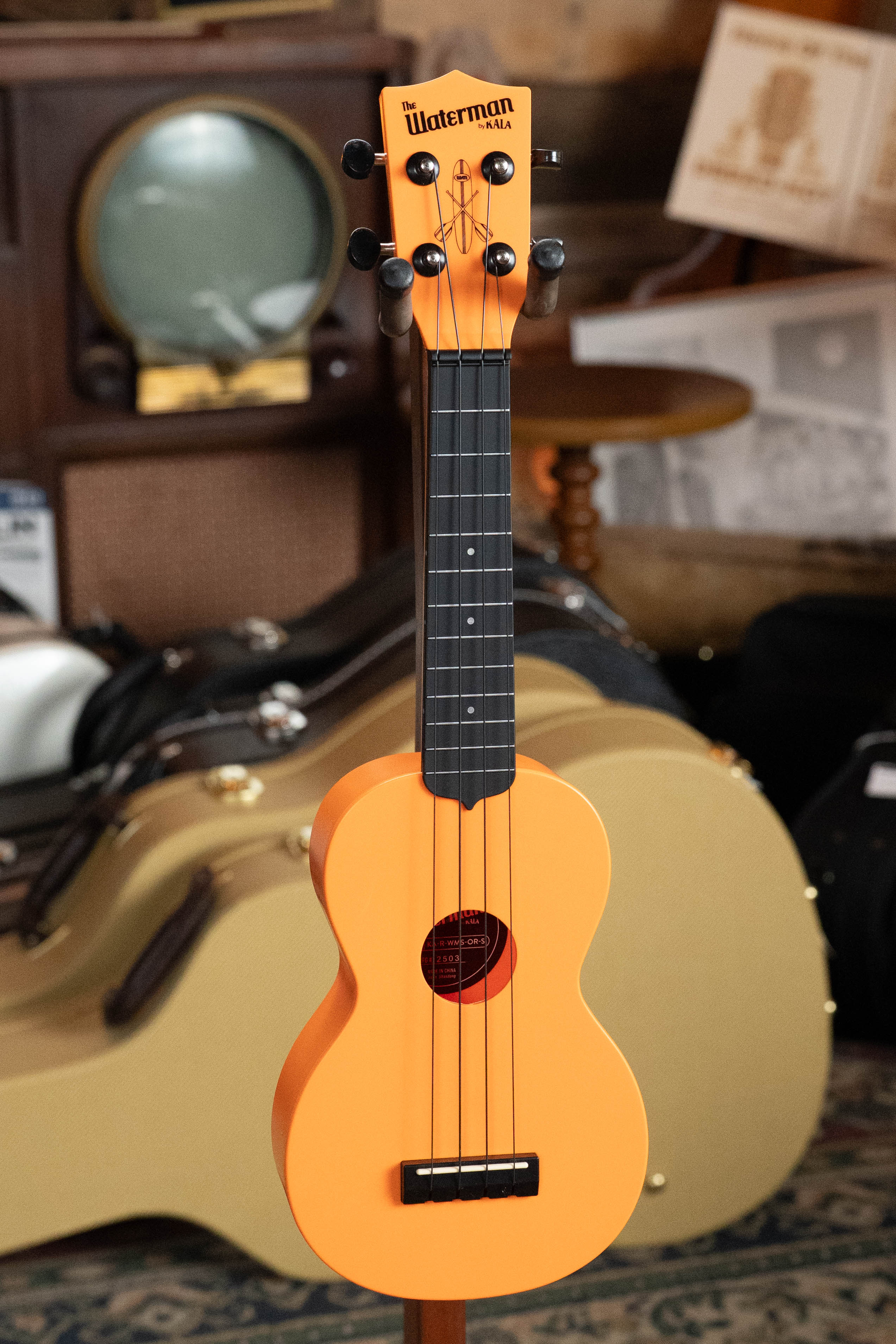Sunset orange soprano ukulele with black tuning pegs and Kala logo on headstock. - The Waterman Sunset Orange Soprano Recycled Ukulele - Kala Brand - Default Title
