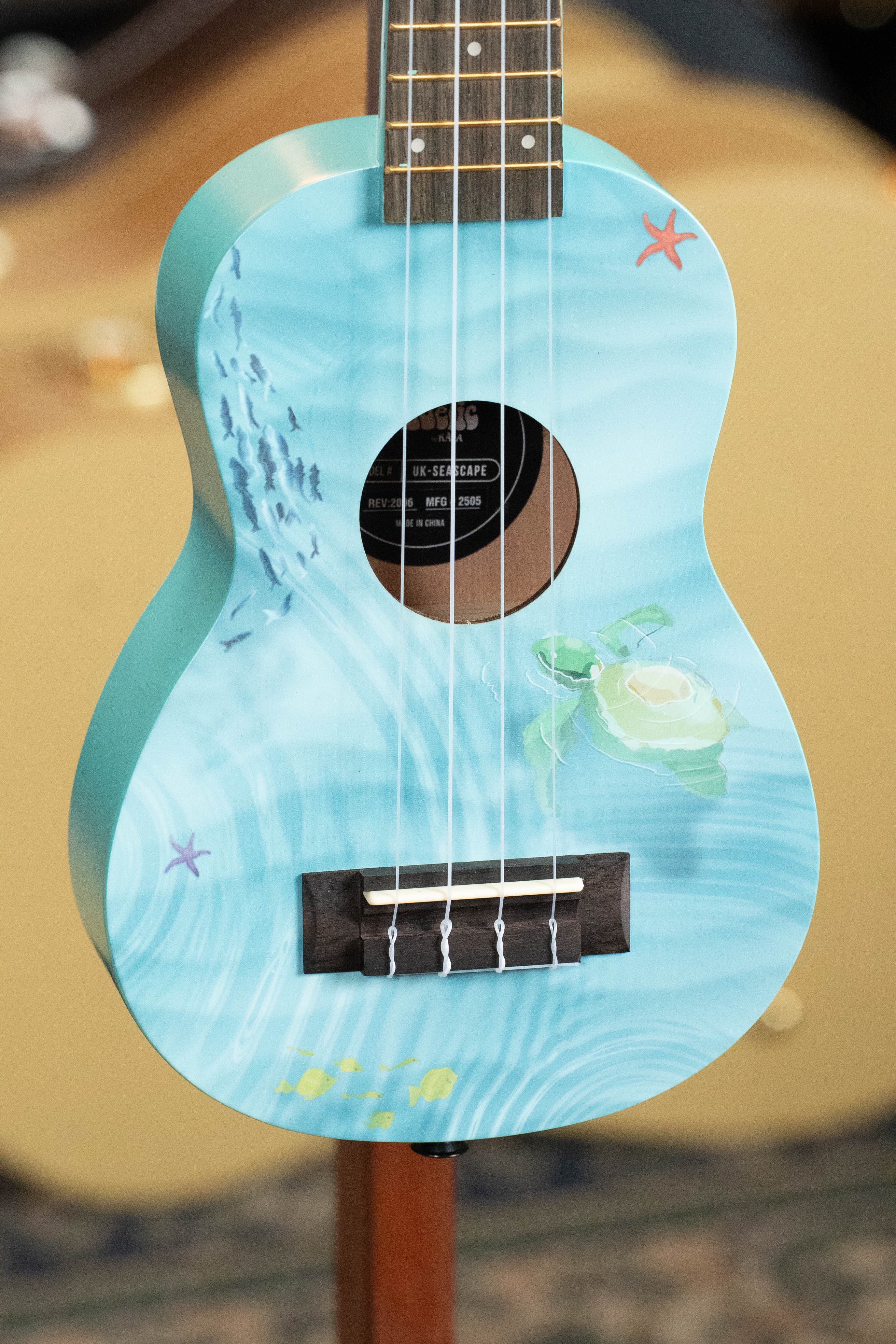 Light blue soprano ukulele with seascape design, white shell detail, and brown fretboard. - Ukadelic Seascape Soprano Ukulele - Kala Brand - Default Title