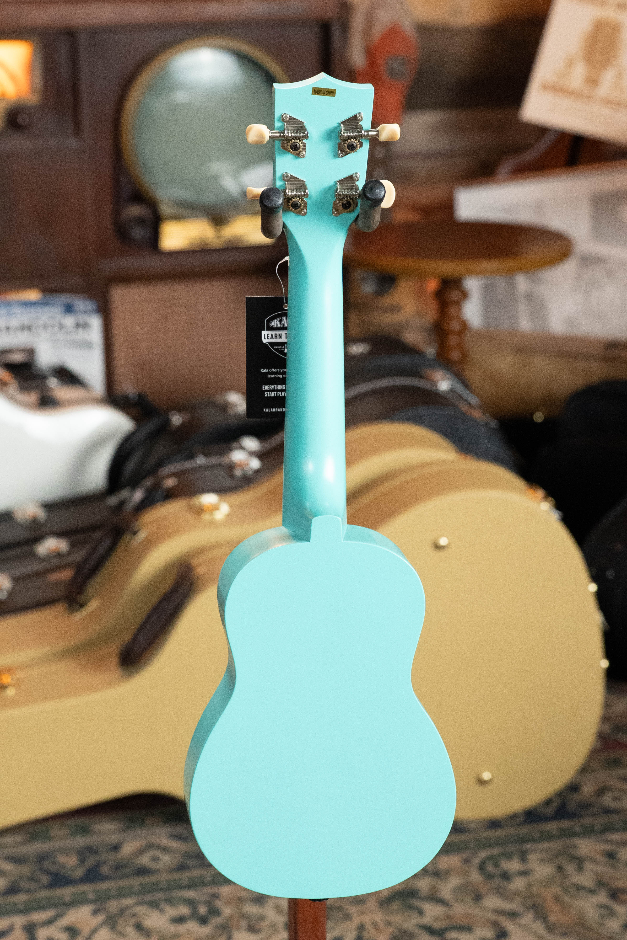 Light blue soprano ukulele with a glossy finish and gold tuning pegs on wooden headstock. - Ukadelic Seascape Soprano Ukulele - Kala Brand - Default Title