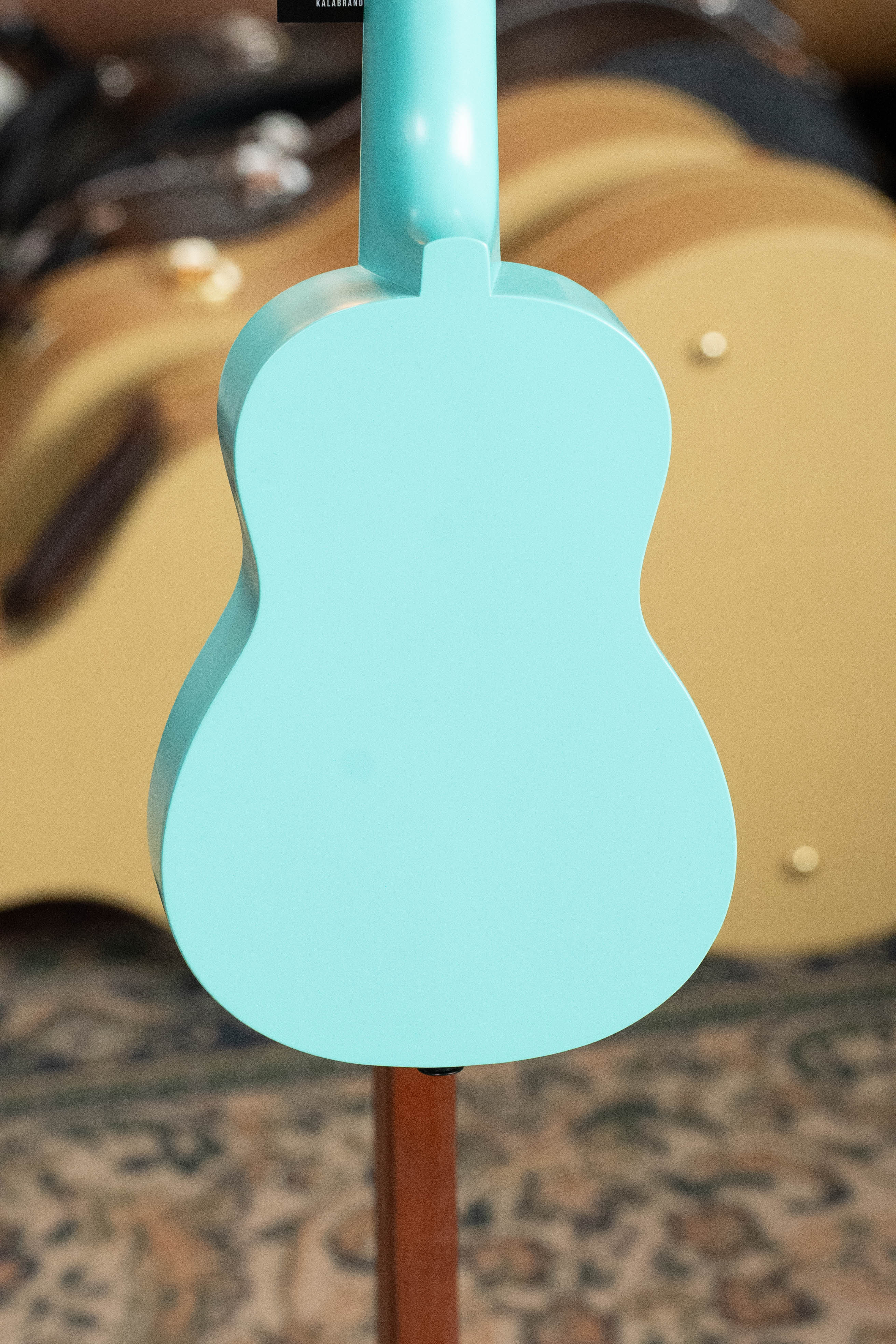 Bright turquoise soprano ukulele back with smooth matte finish and rounded curves. - Ukadelic Seascape Soprano Ukulele - Kala Brand - Default Title