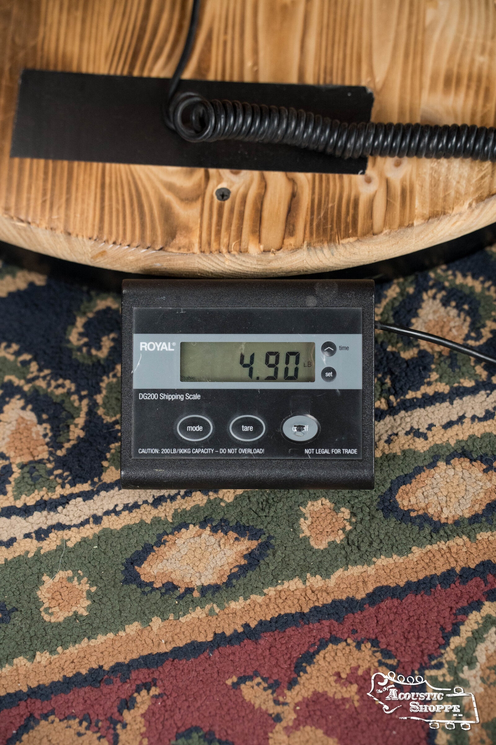 A digital scale on a patterned rug shows 4.90 lbs, with part of a (Used) 1942 Gibson ES-125 by Gibson visible above. The Acoustic Shoppe logo appears in the lower right corner.