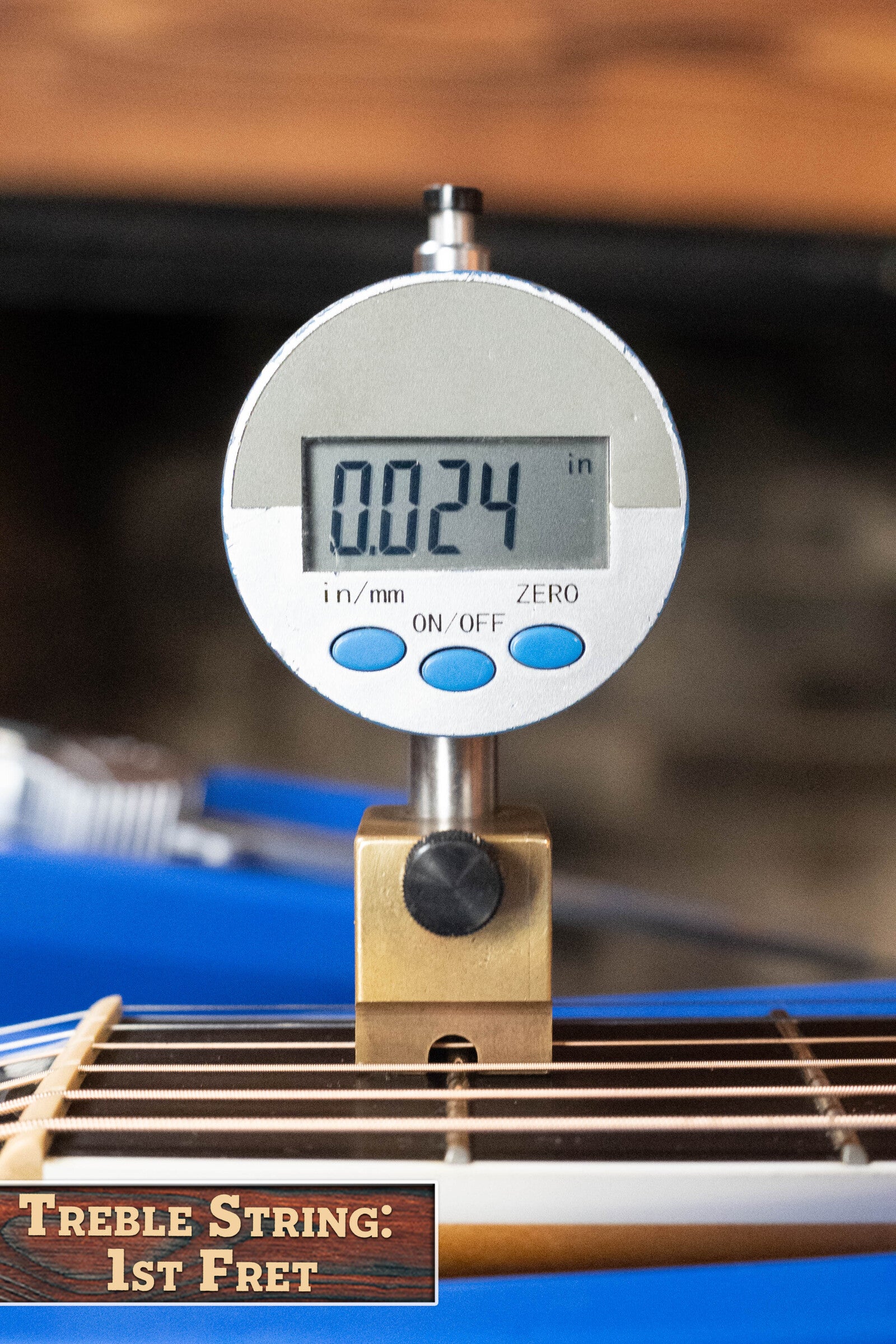 A digital caliper shows 0.024 inches above the high E string at the 1st fret of a (Used) 2009 Taylor Guitars 614CE Torrefied Sitka/Maple Grand Auditorium Cutaway Guitar w/Pickup #5110. Label: Treble String: 1st Fret.