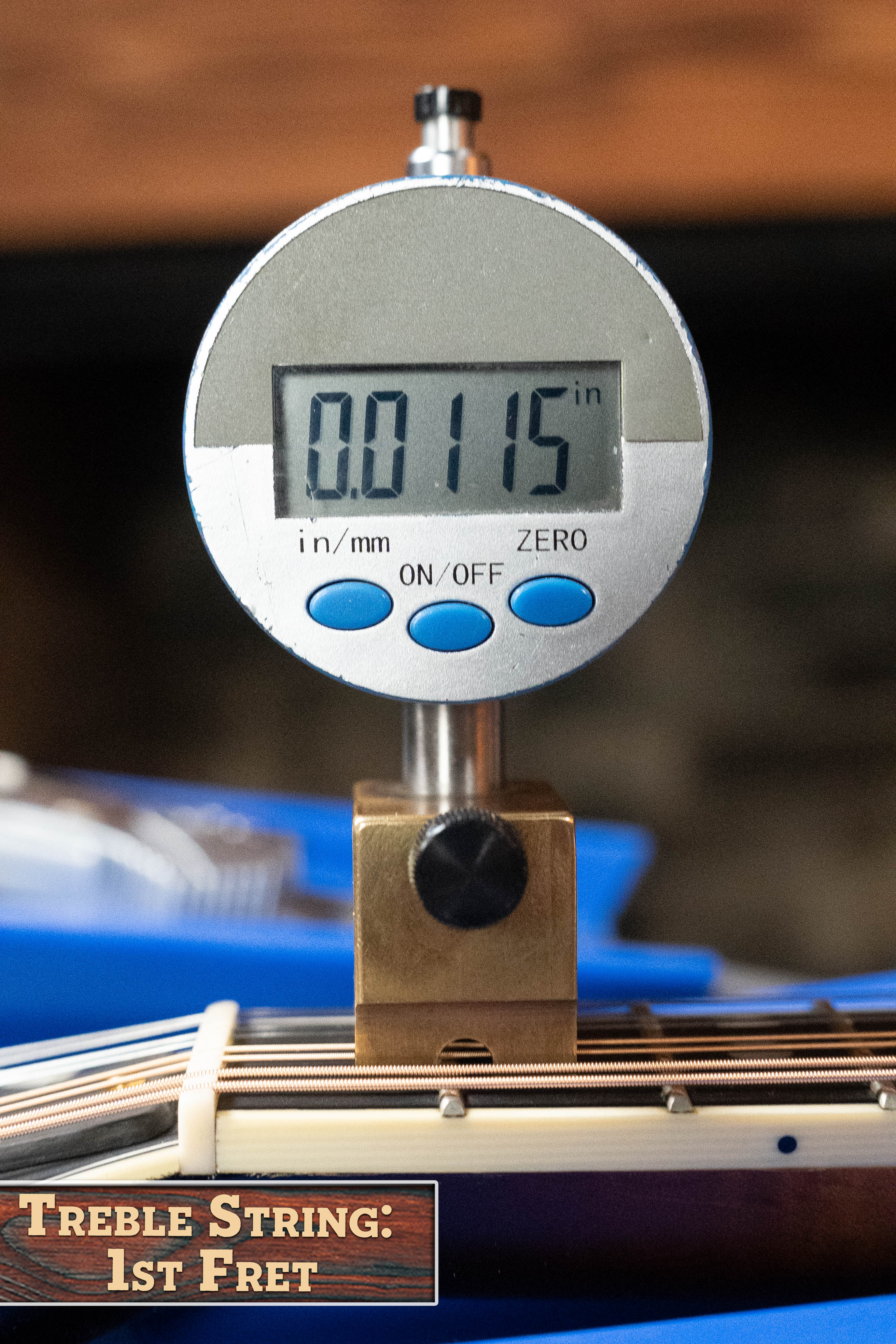 A digital gauge shows 0.0115" measuring the treble string height at the 1st fret on a (Used) 2016 Weber Fern Red Spruce/Flamed Maple A-Style Mandolin #2801. The label reads, "Treble String: 1st Fret.
