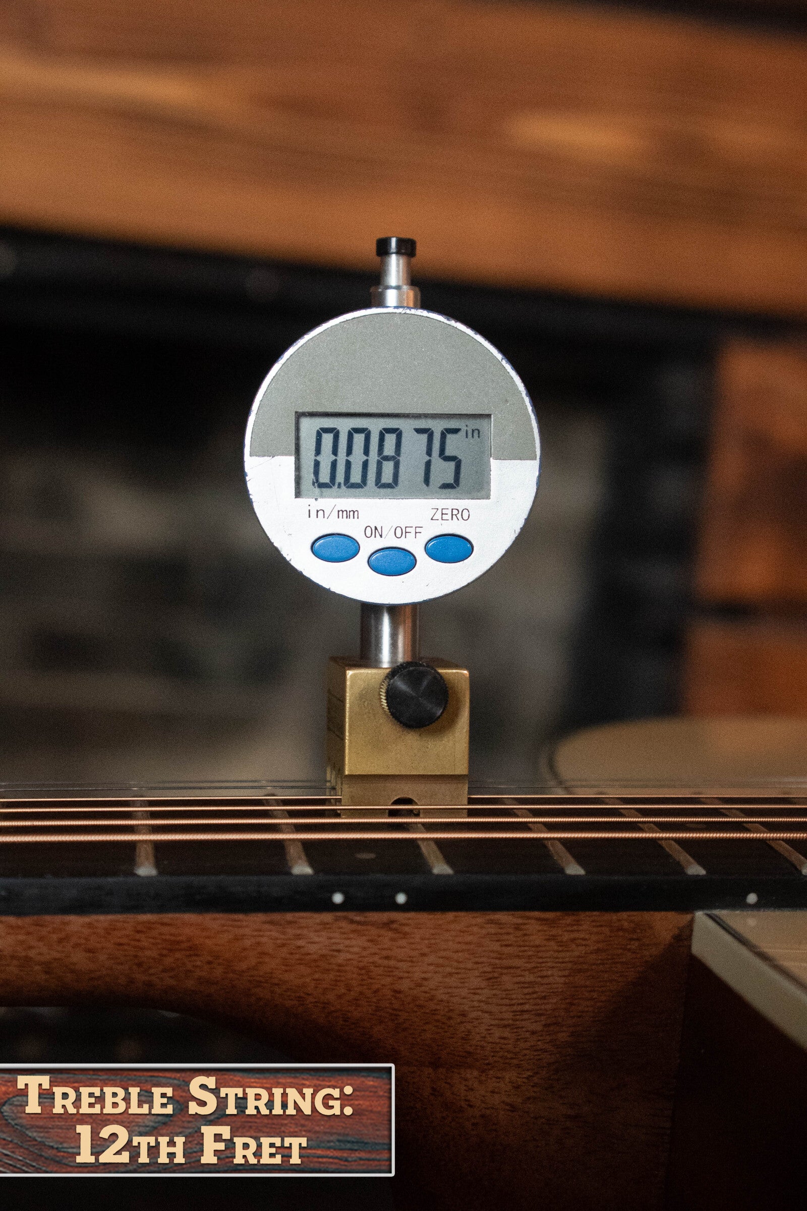 A digital gauge shows 0.0875 inches above the treble string at the 12th fret of a (Used) 2025 Alvarez RD-26 Spruce/Mahogany Dreadnought Acoustic Guitar #0161, with a label reading “Treble String: 12th Fret.”.