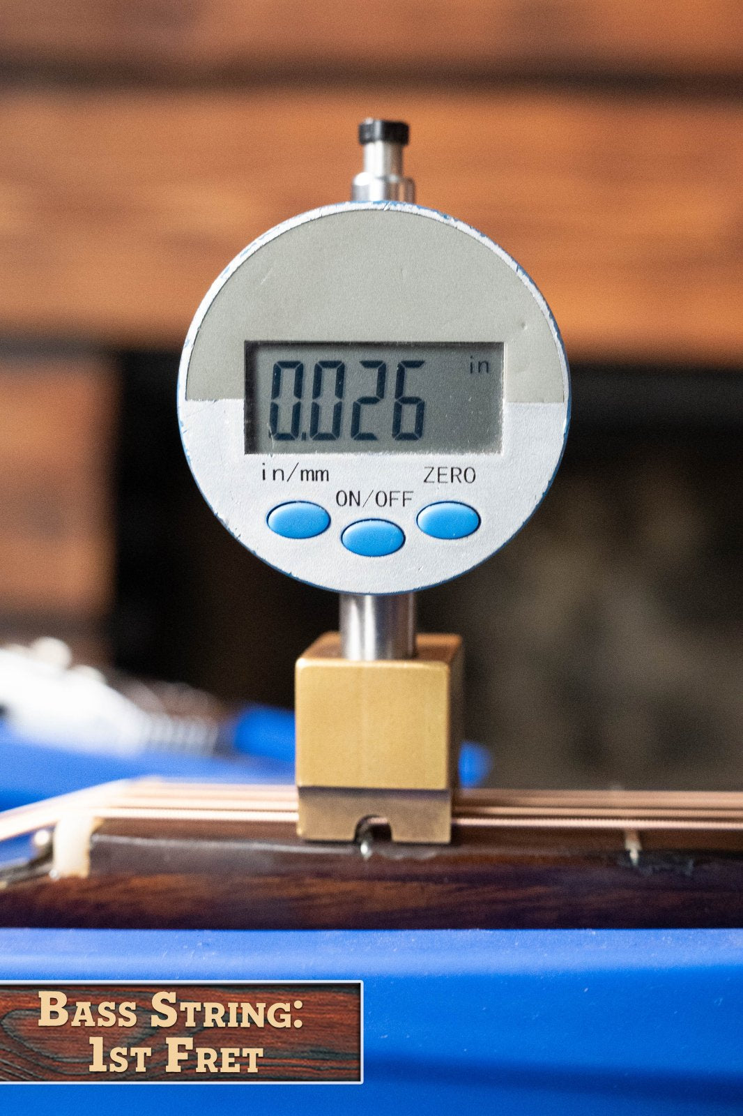 A digital gauge shows the 1st fret string height as 0.026 on a (Used) 1958 Gibson LG-1 Spruce/Mahogany Acoustic Guitar #2758 by Gibson—ideal for checking action on vintage guitars.